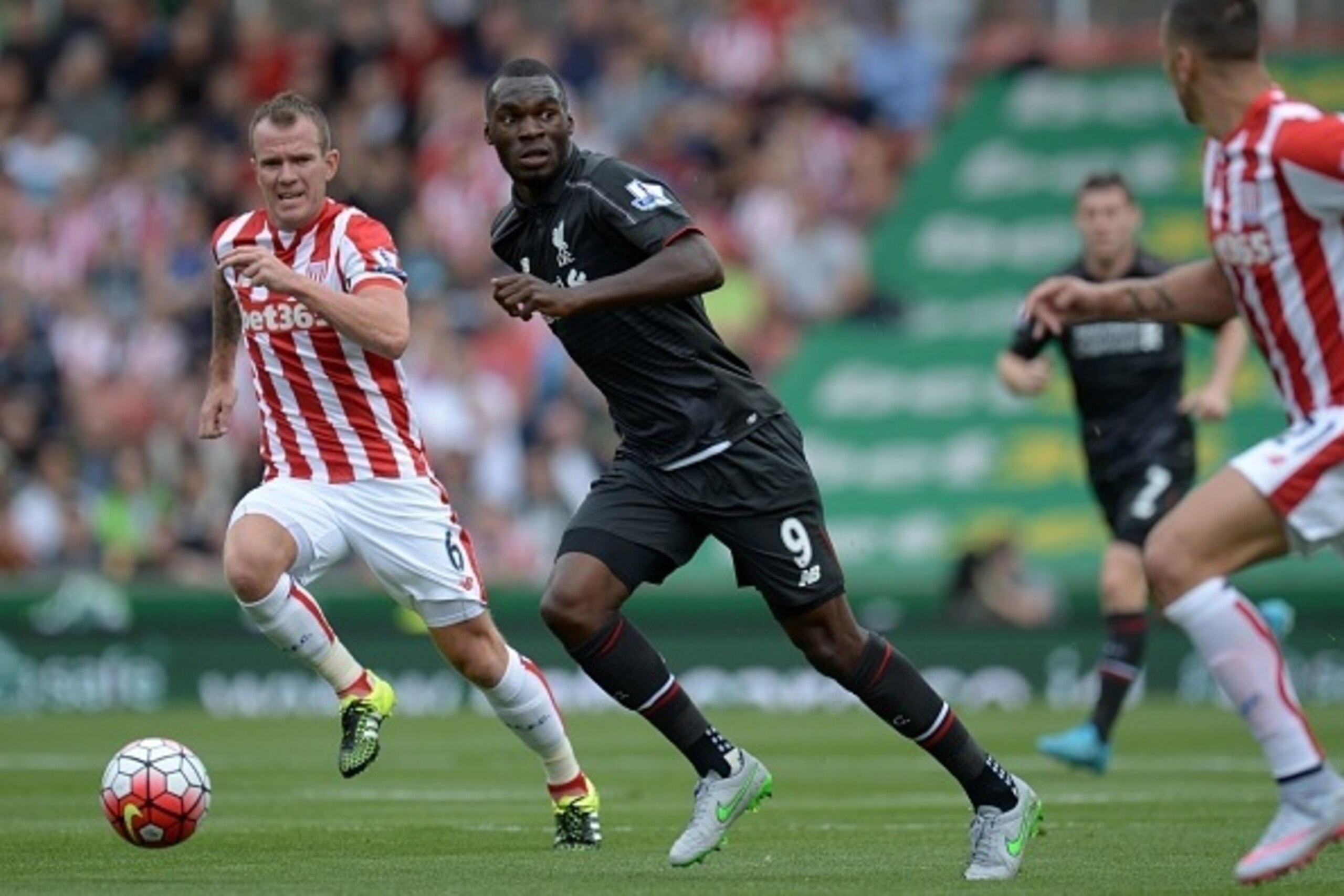 Liverpool's Zaire-born Belgian striker Christian Benteke (2nd L) runs with the ball during the English Premier League football match between Stoke City and Liverpool at the Britannia Stadium in Stoke-on-Trent, central England on August 9, 2015. AFP PHOTO 