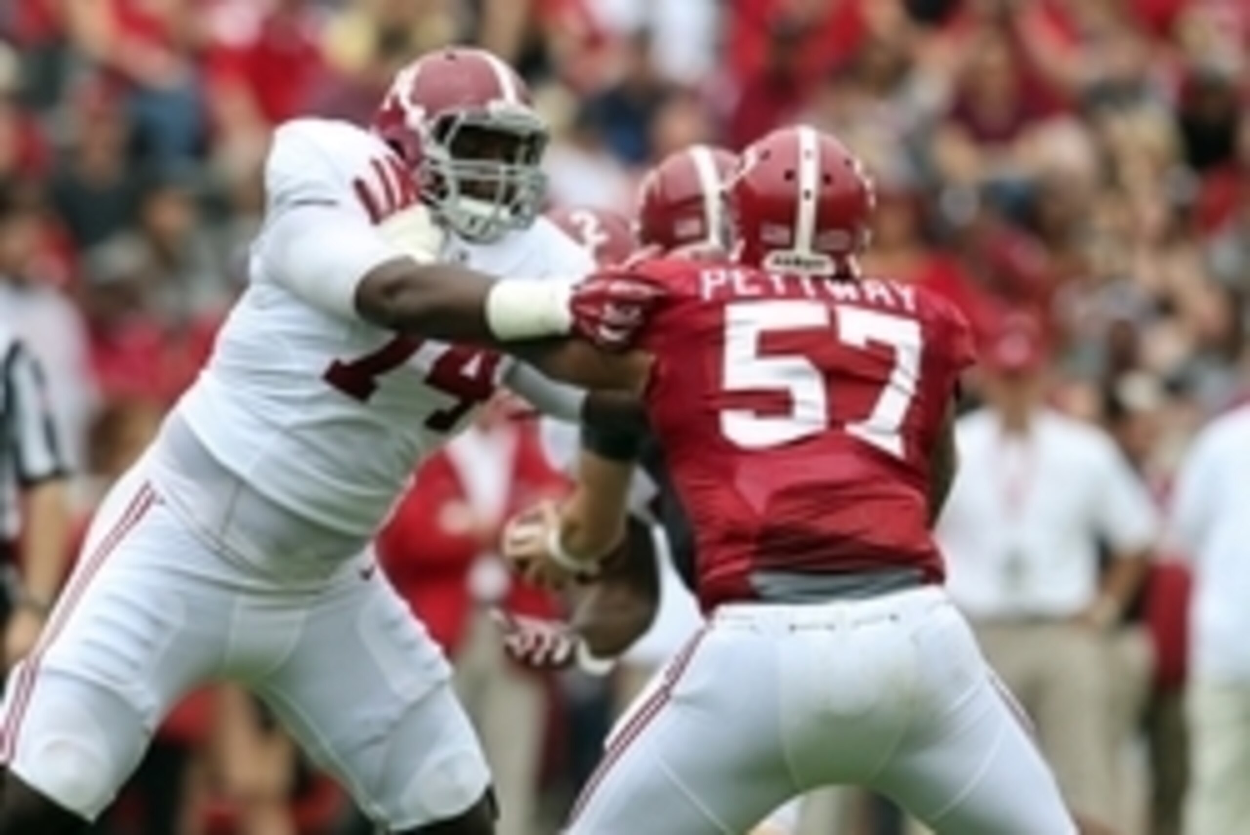 Apr 18, 2015; Tuscaloosa, AL, USA; Alabama Crimson Tide offensive lineman Cam Robinson (74) blocks Alabama Crimson Tide defensive lineman D.J. Pettway (57) during the annual A-day game at Bryant Denny Stadium. Mandatory Credit: Marvin Gentry-USA TODAY Spo
