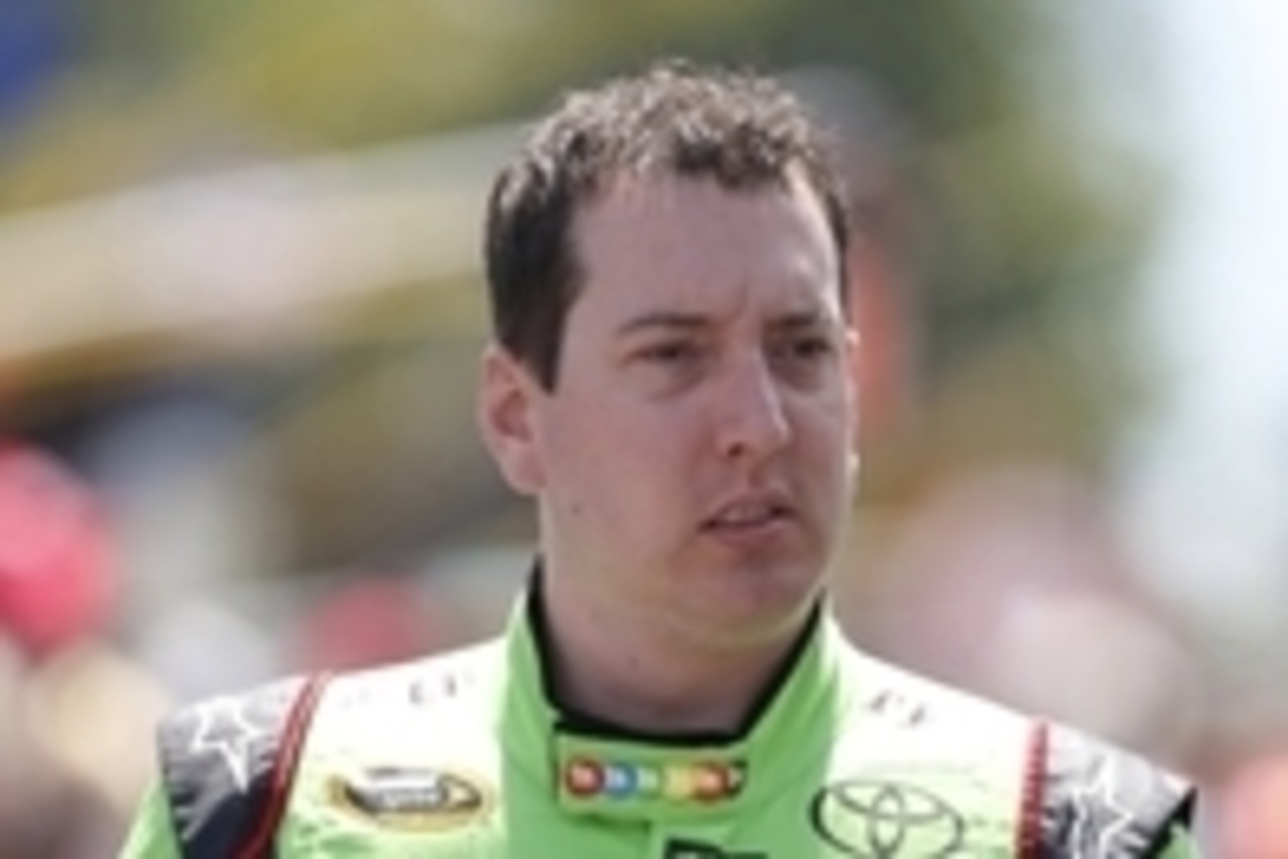 Aug 9, 2015; Watkins Glen, NY, USA; Sprint Cup Series driver Kyle Busch (18) walks to his car before the Cheez-It 355 at Watkins Glen International. Sprint Cup Series driver Joey Logano won the race. Mandatory Credit: Kevin Hoffman-USA TODAY Sports