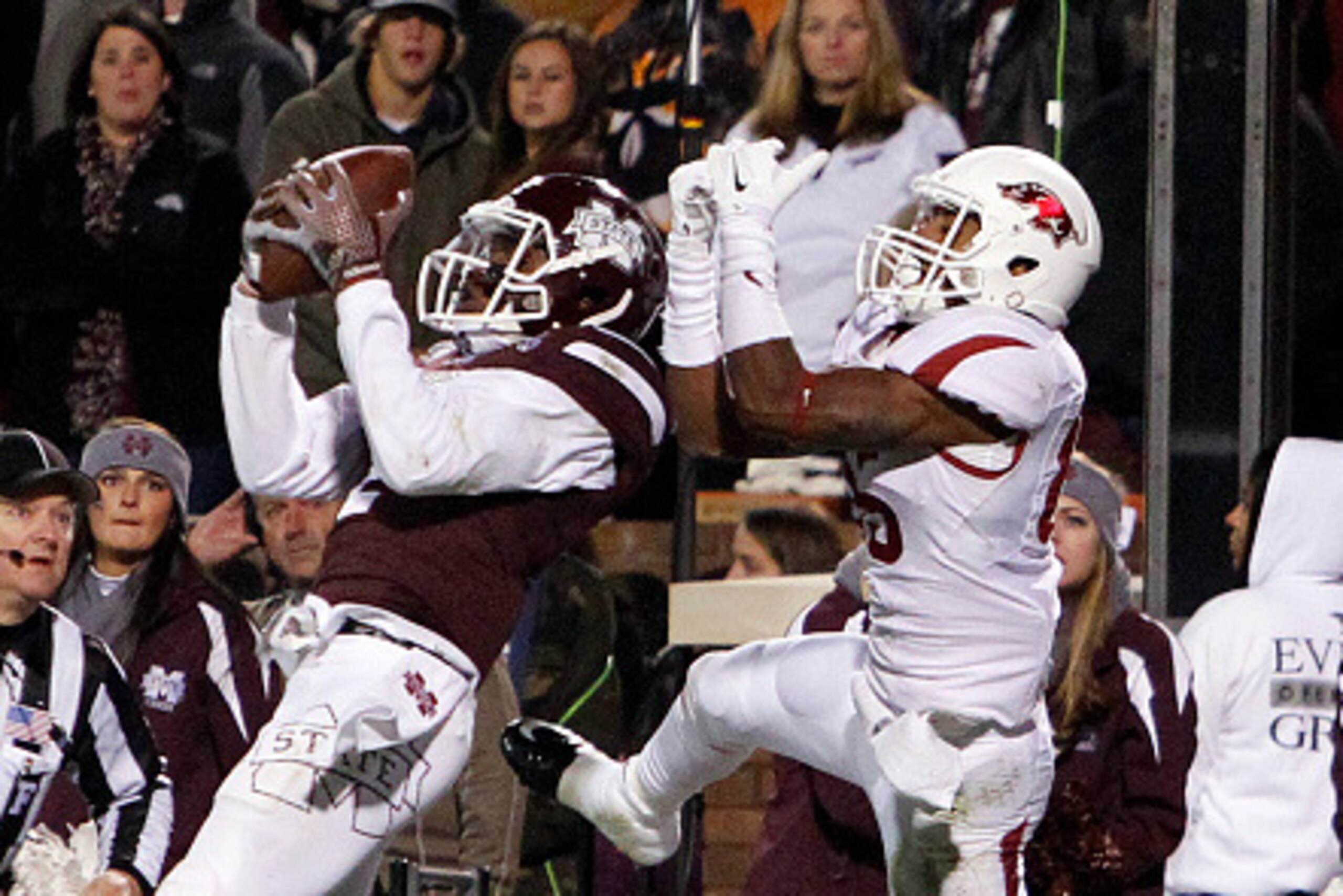 STARKVILLE, MS - NOVEMBER 2:  Will Redmond #2 of the Mississippi State Bulldogs intercepts a pass in the end zone intended for Demetrius Wilson #85 of the Arkansas Razorbacks to secure the win over the Razorbacks 17-10 in the second half at Davis Wade Sta