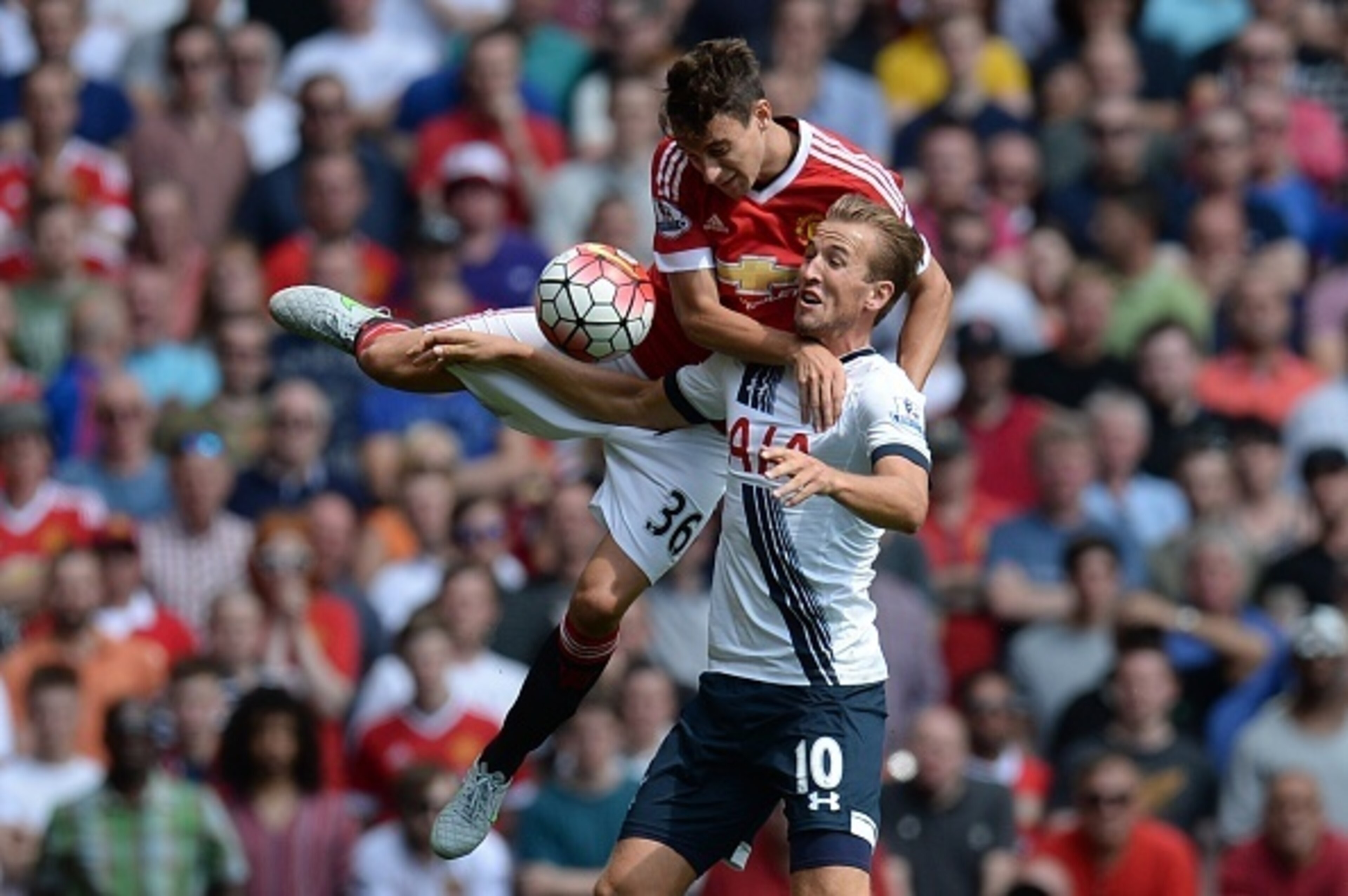 Manchester United's Italian defender Matteo Darmian (up) vies with Tottenham Hotspur's English striker Harry Kane during the English Premier League football match between Manchester United and Tottenham Hotspur at Old Trafford in Manchester, north west En Manchester United's Italian defender Matteo Darmian (up) vies with Tottenham Hotspur's English striker Harry Kane during the English Premier League football match between Manchester United and Tottenham Hotspur at Old Trafford in Manchester, north west En