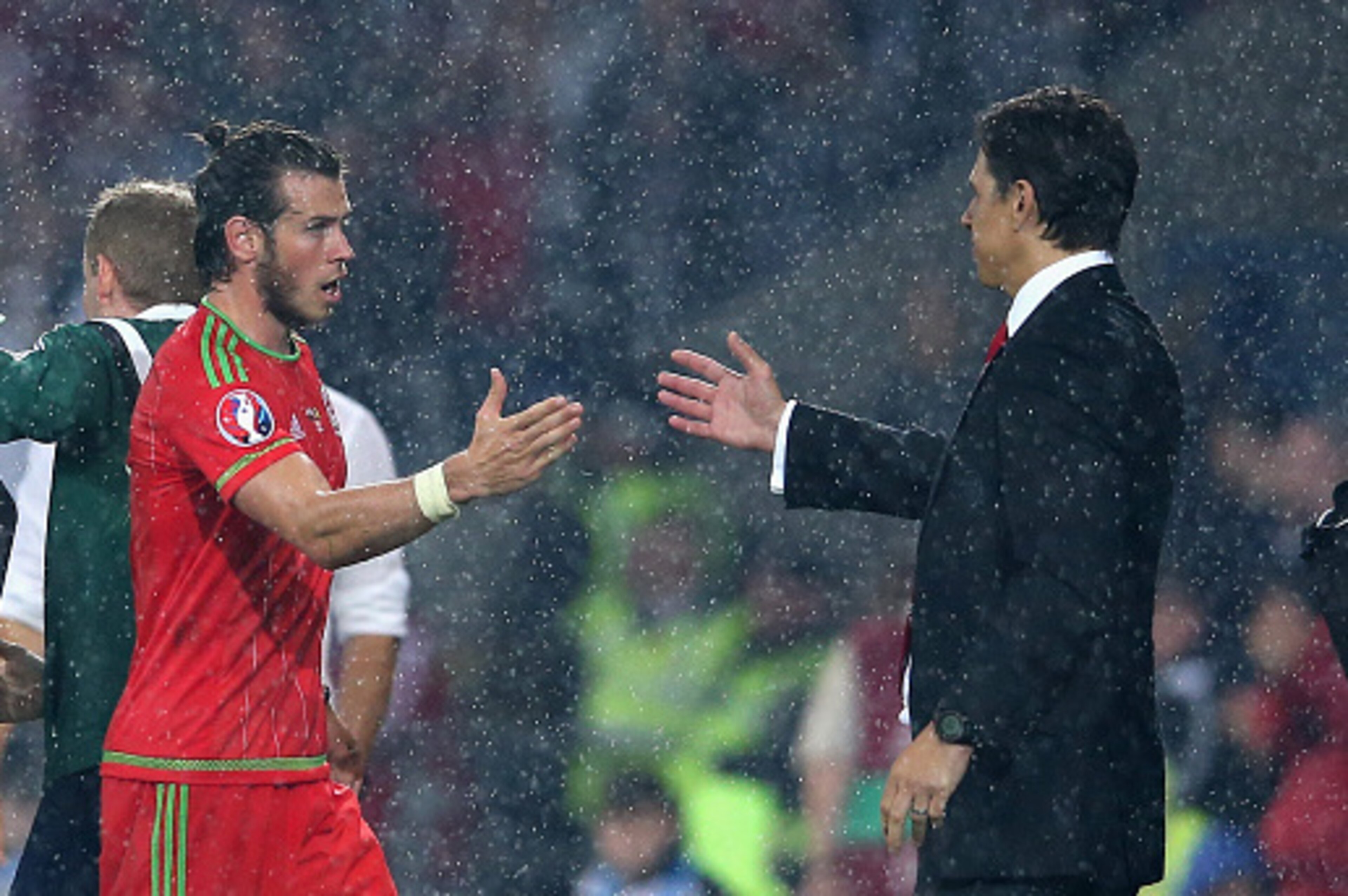 CARDIFF, WALES - JUNE 12:  Gareth Bale of Wales, who scored the winning goal shakes hands with Wales manager Chris Coleman as he is subsituted during the UEFA EURO 2016 qualifying match between Wales and Belgium at the Cardiff City Stadium on June 12, 201