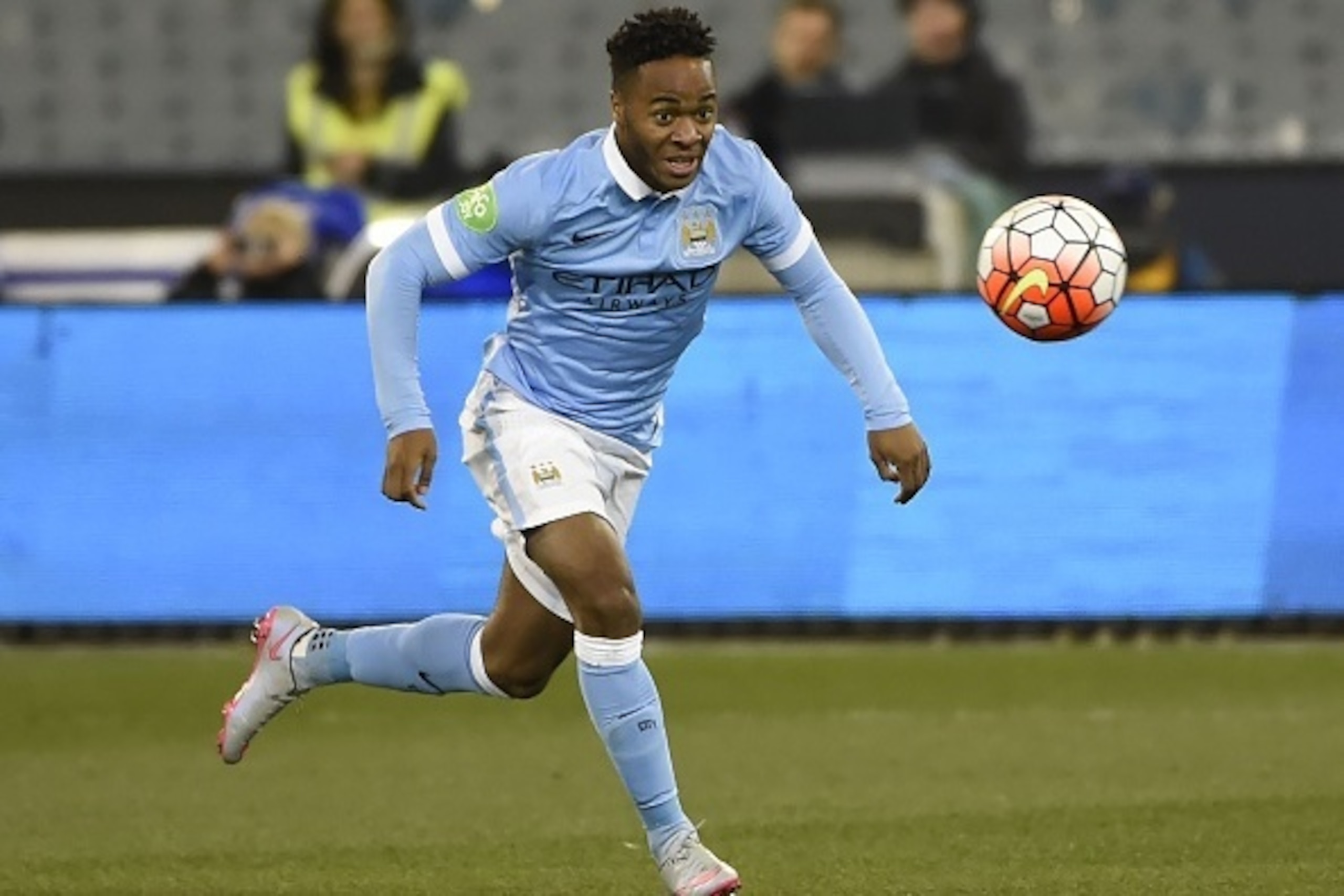 Raheem Sterling of Manchester City eyes the ball during the International Champions Cup football match between English Premier League team Manchester City and Italian side AS Roma in Melbourne on July 21, 2015. AFP PHOTO / Mal FAIRCLOUGH -- IMAGE RESTRICT