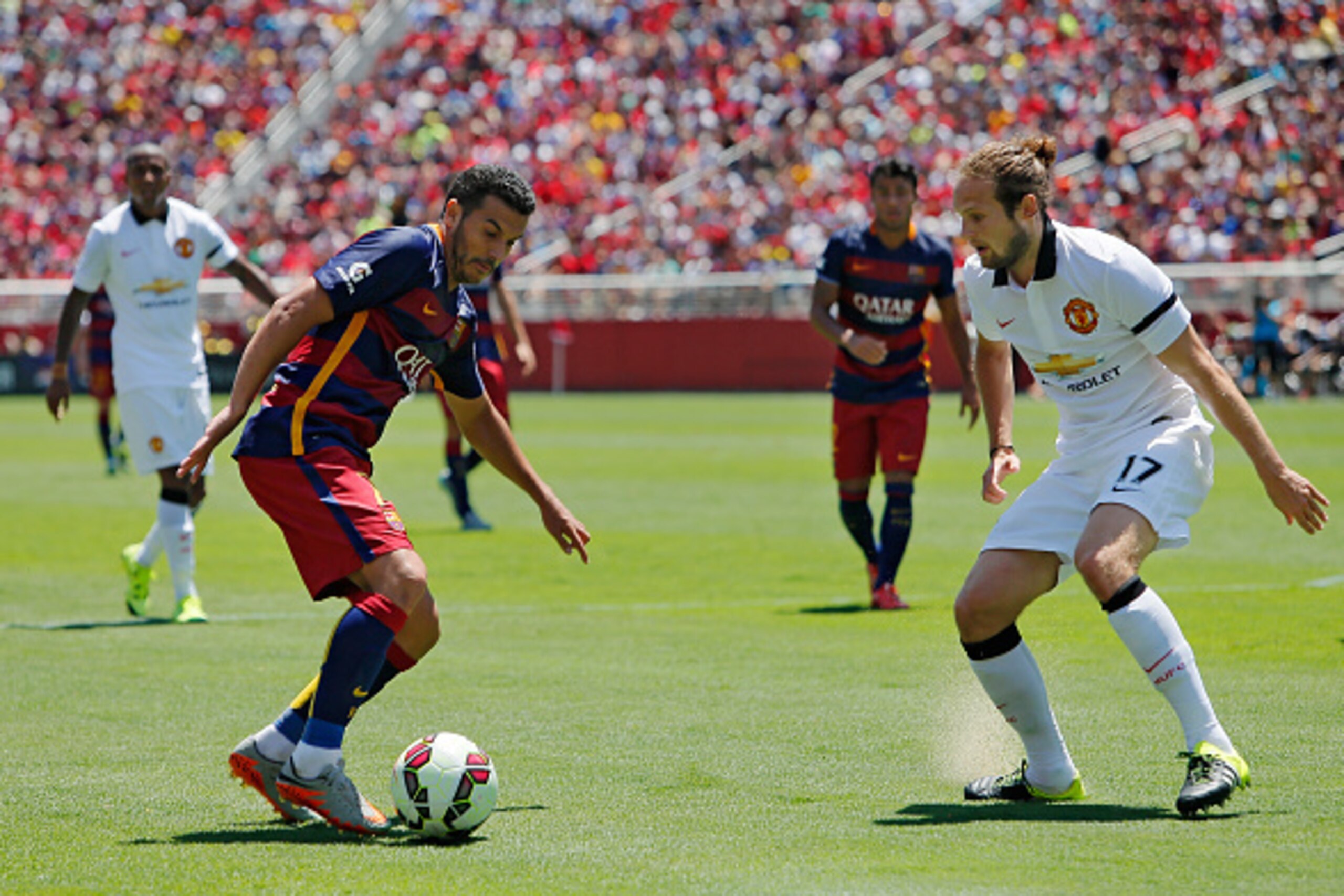 SANTA CLARA, CA - JULY 25:  Pedro Rodriguez #7 of FC Barcelona looks for a better opening in front of the goal against Daley Blind #17 of Manchester United in the first half during the International Champions Cup on July 25, 2015 at Levi's Stadium in Sant