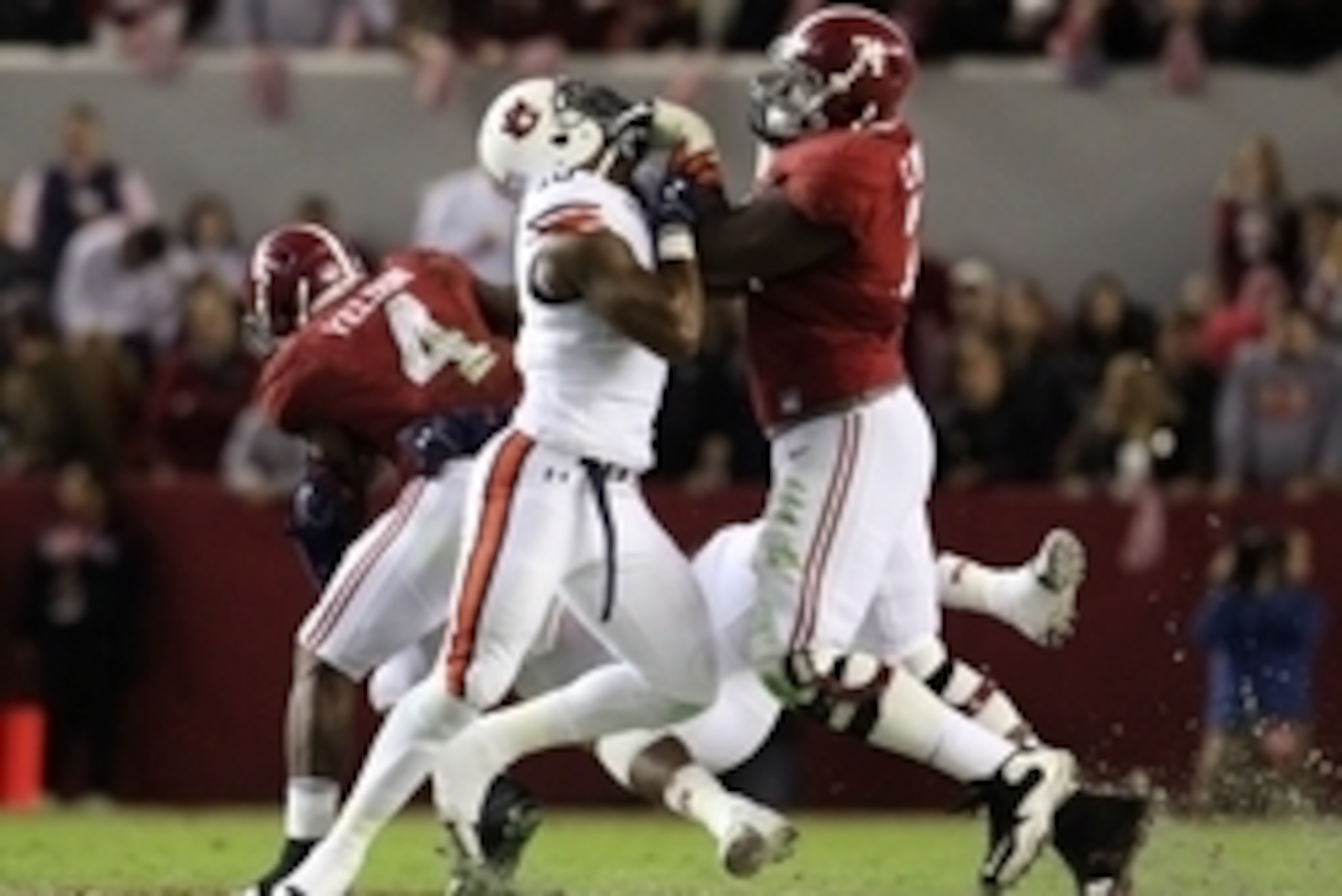 Nov 29, 2014; Tuscaloosa, AL, USA; Alabama Crimson Tide offensive lineman Cam Robinson (74) battles Auburn Tigers defensive lineman LaDarius Owens (10) in the third quarter at Bryant-Denny Stadium. Mandatory Credit: Marvin Gentry-USA TODAY Sports