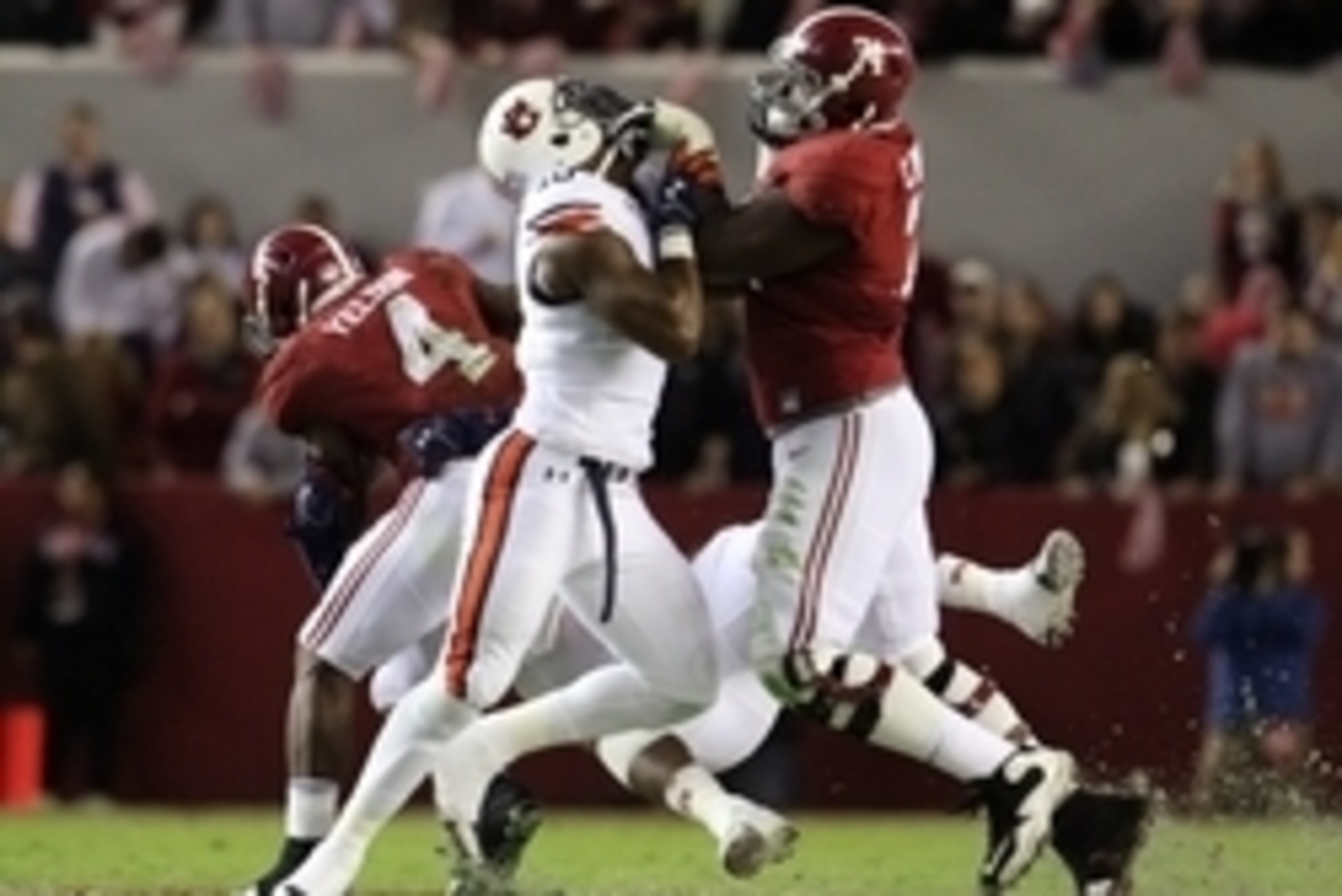 Nov 29, 2014; Tuscaloosa, AL, USA; Alabama Crimson Tide offensive lineman Cam Robinson (74) battles Auburn Tigers defensive lineman LaDarius Owens (10) in the third quarter at Bryant-Denny Stadium. Mandatory Credit: Marvin Gentry-USA TODAY Sports