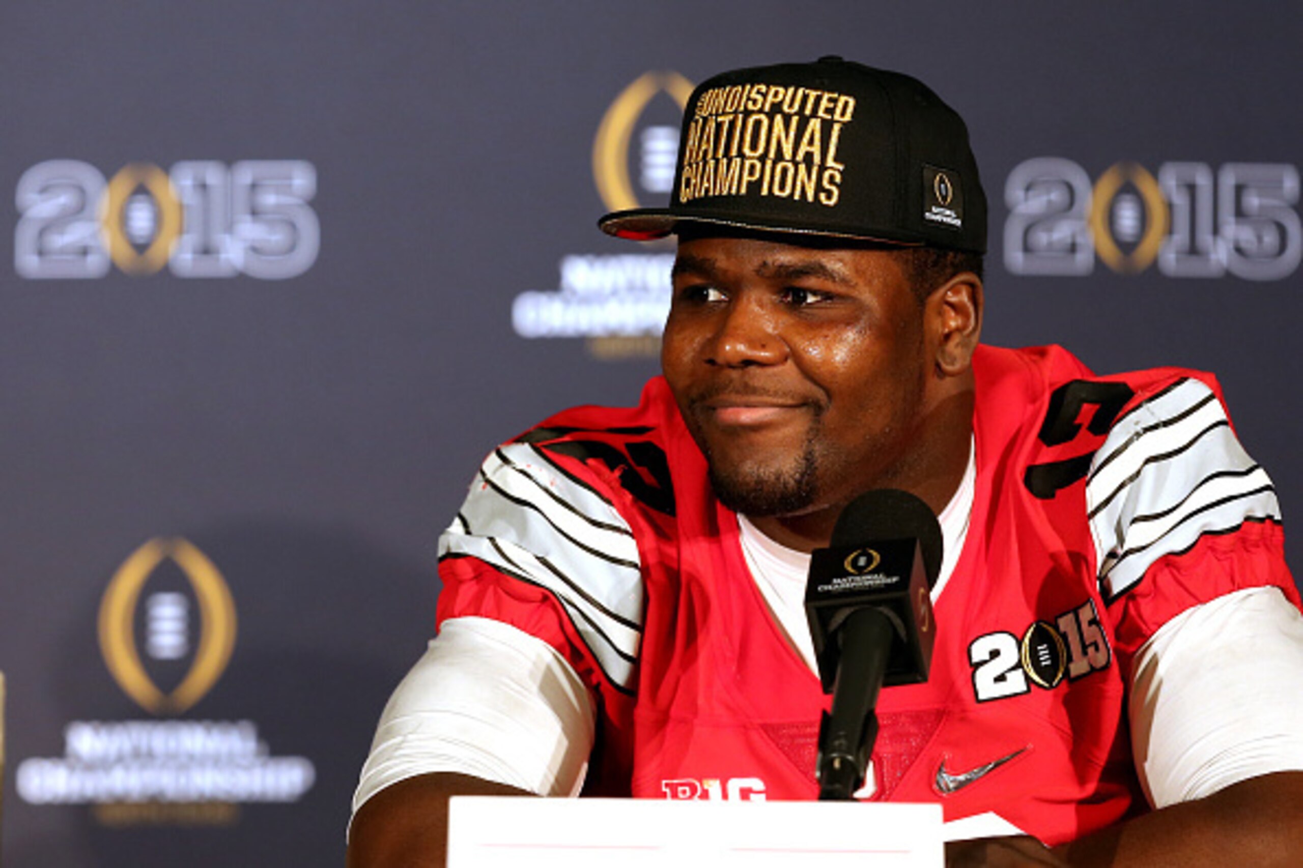 ARLINGTON, TX - JANUARY 12:  Quarterback Cardale Jones #12 of the Ohio State Buckeyes talks to the media after defeating the Oregon Ducks during the College Football Playoff National Championship Game at AT&T Stadium on January 12, 2015 in Arlington, Texa