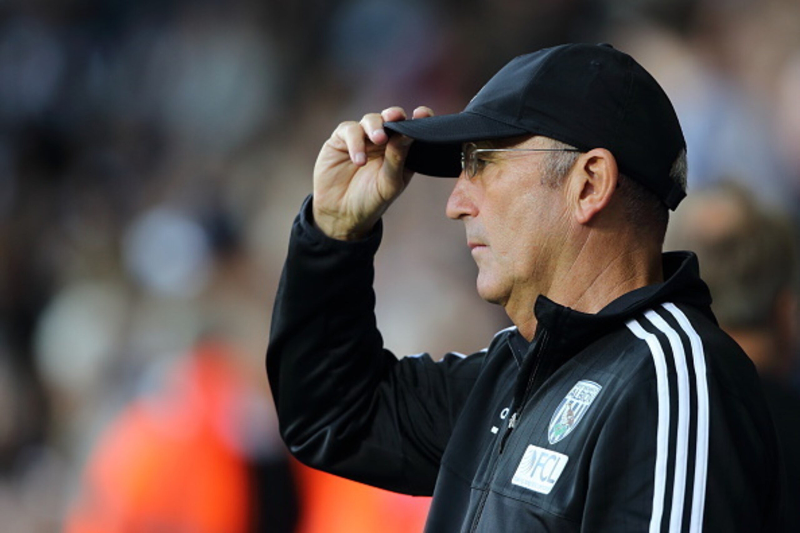 WEST BROMWICH, ENGLAND - AUGUST 10:  Tony Pulis the manager of West Bromwich Albion adjusts his cap during the Barclays Premier League match between West Bromwich Albion and Manchester City at The Hawthorns  on August 10, 2015 in West Bromwich, England.  