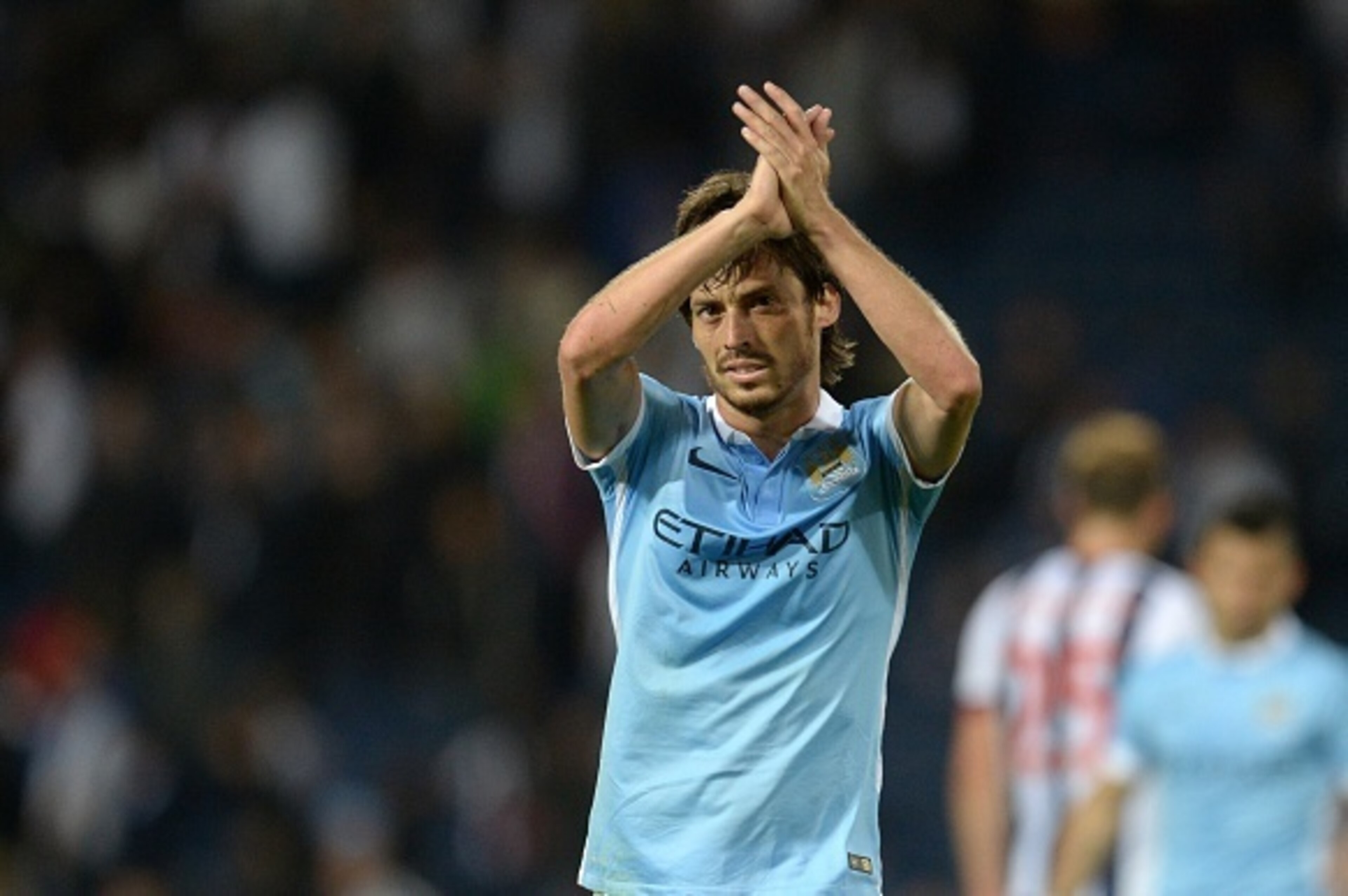 Manchester City's Spanish midfielder David Silva applauds fans after winning the English Premier League football match between West Bromwich Albion and Manchester City at The Hawthorns in West Bromwich, central England, on August 10, 2015.
AFP PHOTO / OLI