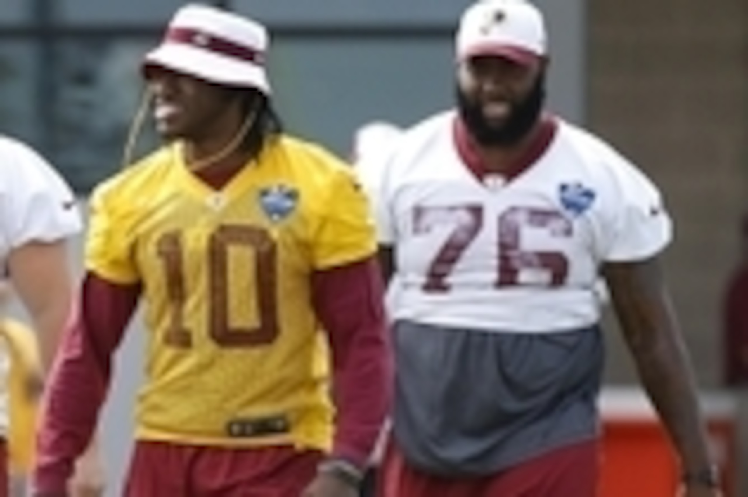 Jul 30, 2015; Richmond, VA, USA; Washington Redskins quarterback Robert Griffin III (10) and Redskins tackle Morgan Moses (76) walk onto the field prior to the morning walkthrough on day one of training camp at the Washington Redskins Bon Secours Training