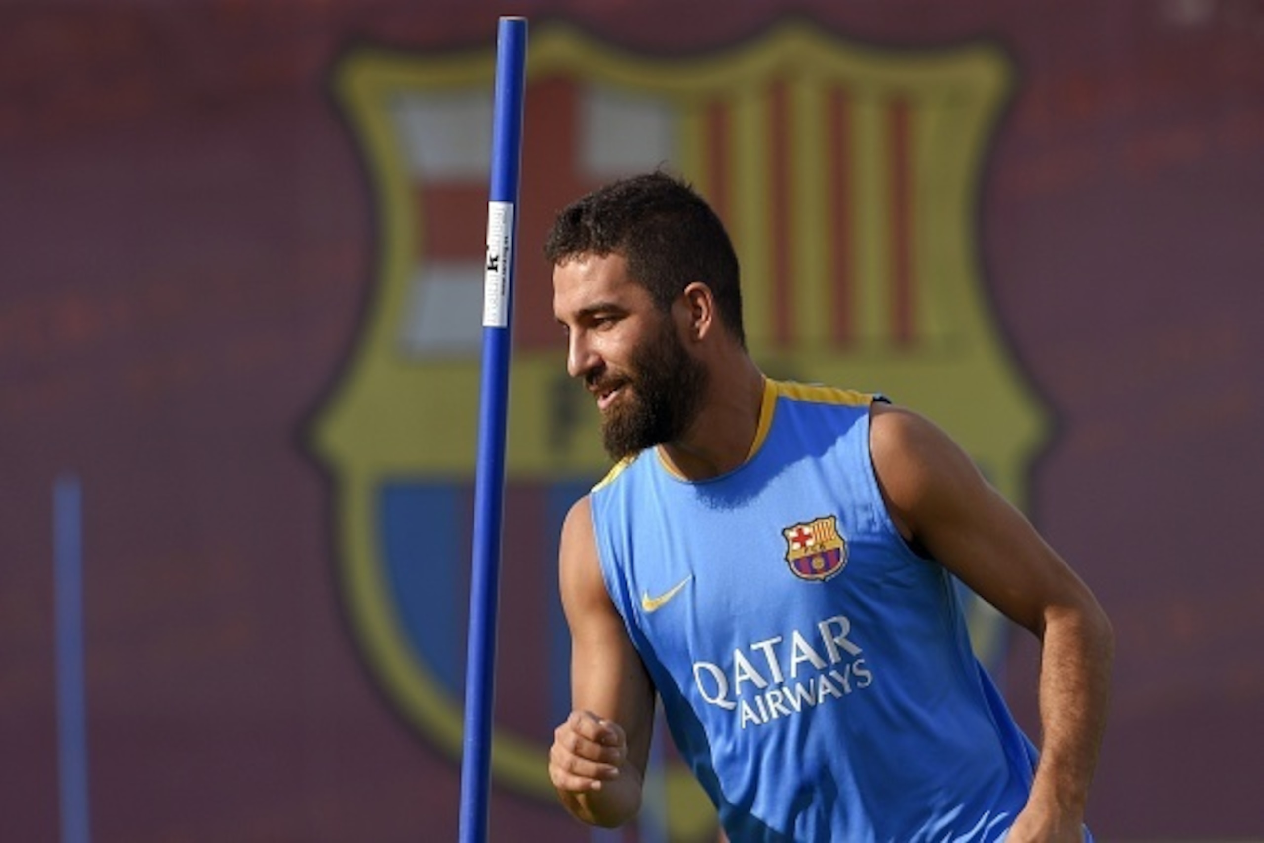 Barcelona's Turkish midfielder Arda Turan takes part in a training session at the Sports Center FC Barcelona Joan Gamper in Sant Joan Despi, near Barcelona on July 15, 2015. AFP PHOTO/ LLUIS GENE        (Photo credit should read LLUIS GENE/AFP/Getty Image