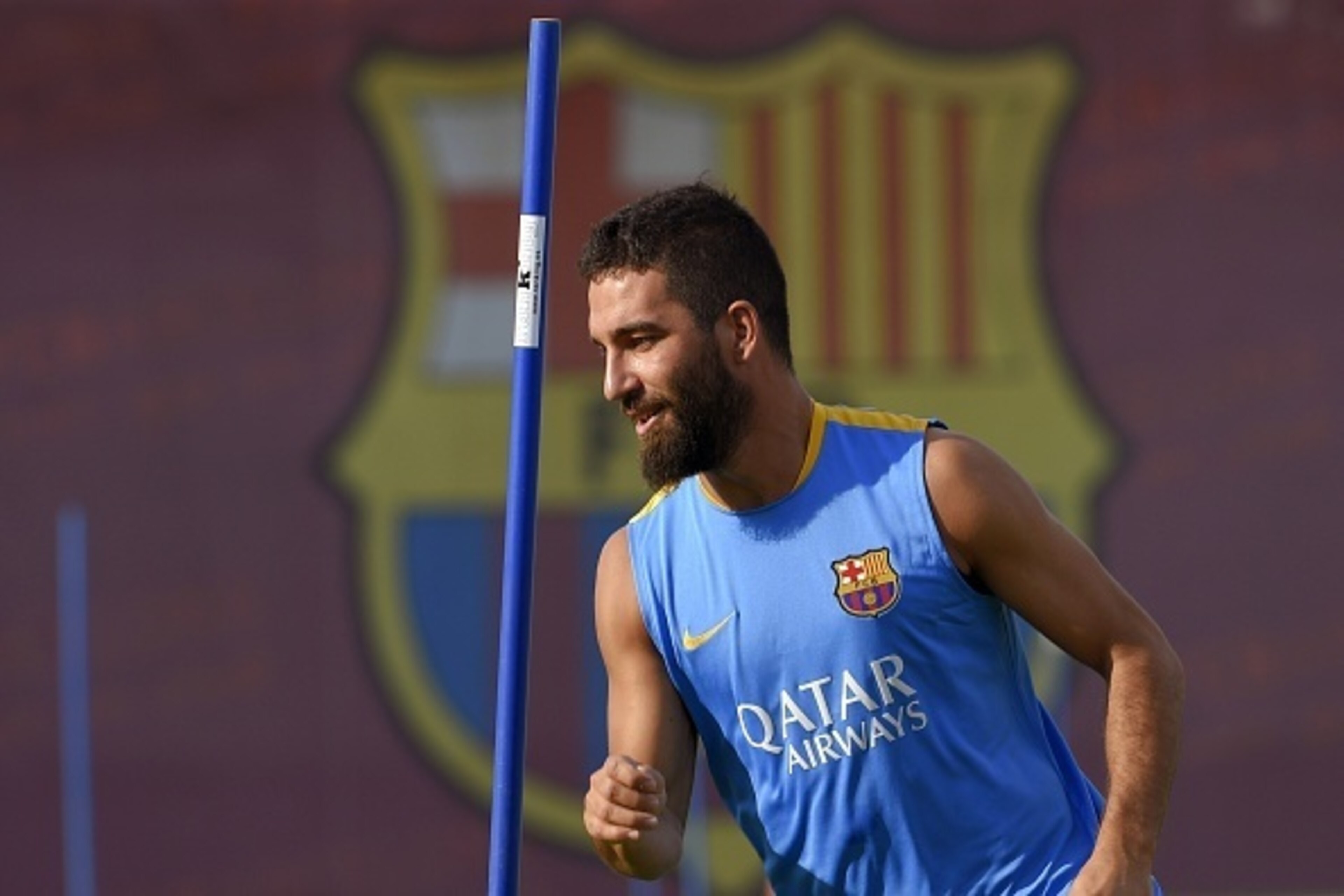 Barcelona's Turkish midfielder Arda Turan takes part in a training session at the Sports Center FC Barcelona Joan Gamper in Sant Joan Despi, near Barcelona on July 15, 2015. AFP PHOTO/ LLUIS GENE        (Photo credit should read LLUIS GENE/AFP/Getty Image