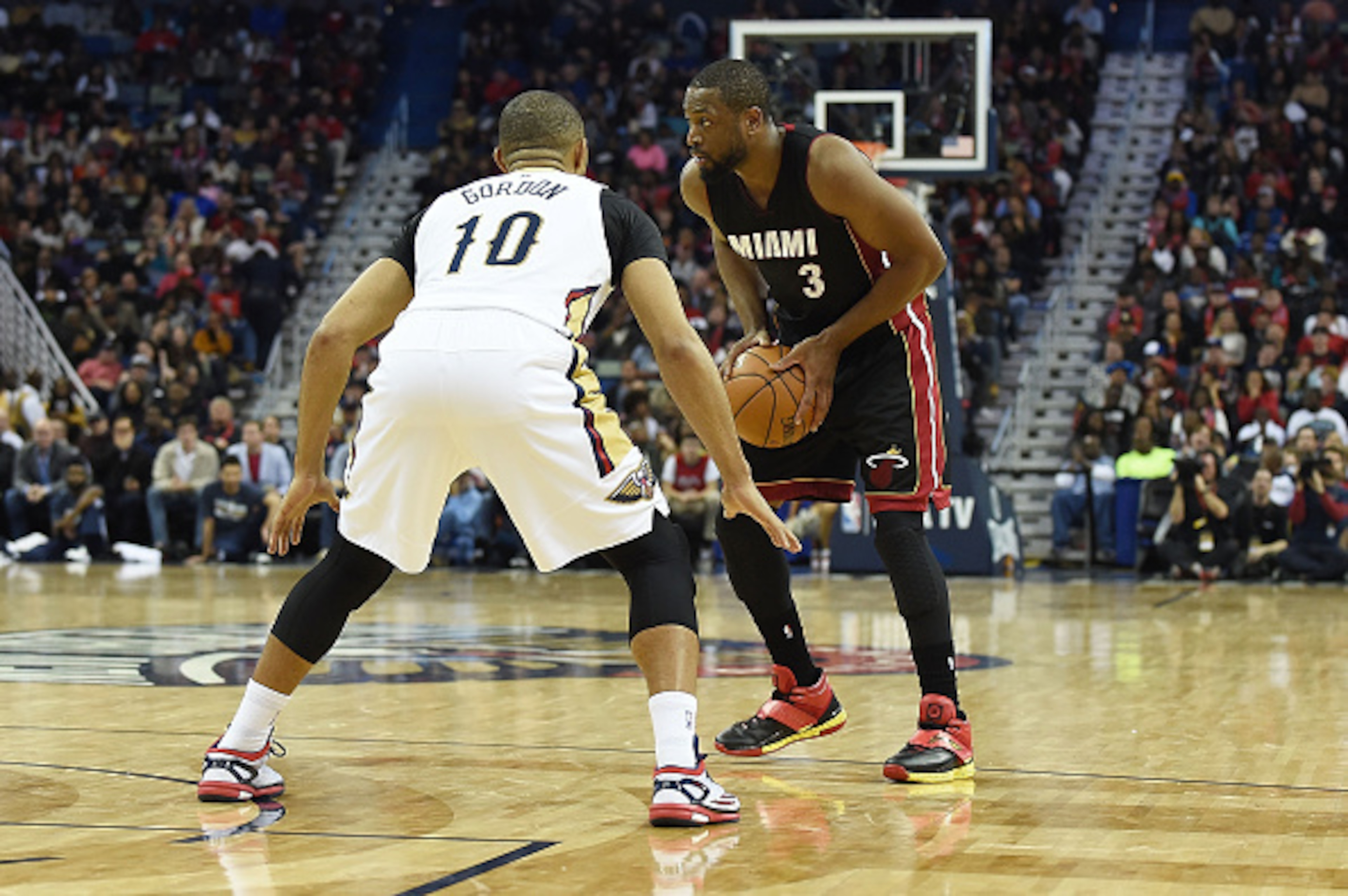 NEW ORLEANS, LA - FEBRUARY 27:  Dwyane Wade #3 of the Miami Heat works against Eric Gordon #10 of the New Orleans Pelicans during the second half of a game at the Smoothie King Center on February 27, 2015 in New Orleans, Louisiana.  NOTE TO USER: User exp