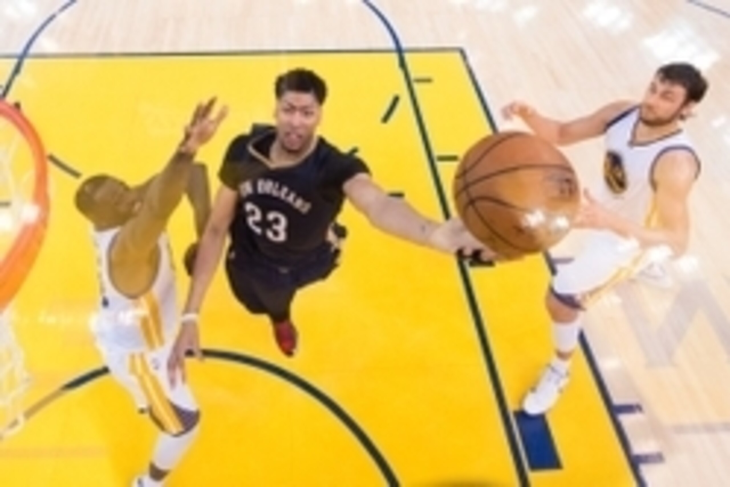 April 20, 2015; Oakland, CA, USA; New Orleans Pelicans forward Anthony Davis (23, center) shoots a layup against Golden State Warriors forward Draymond Green (23, left) and center Andrew Bogut (12) during the second half in game two of the first round of 