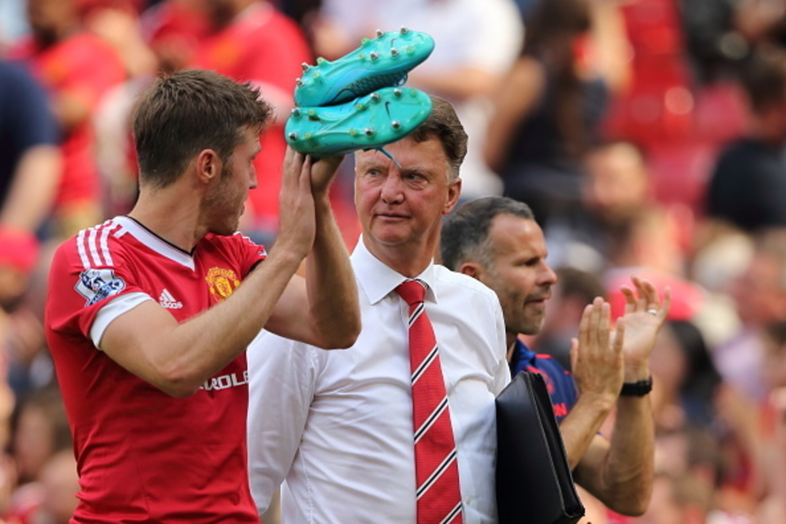 MANCHESTER, ENGLAND - AUGUST 08:  Louis van Gaal the head coach / manager of Manchester United walks off with Michael Carrick  after the Barclays Premier League match between Manchester United and Tottenham Hotspur at Old Trafford on August 08, 2015 in Ma