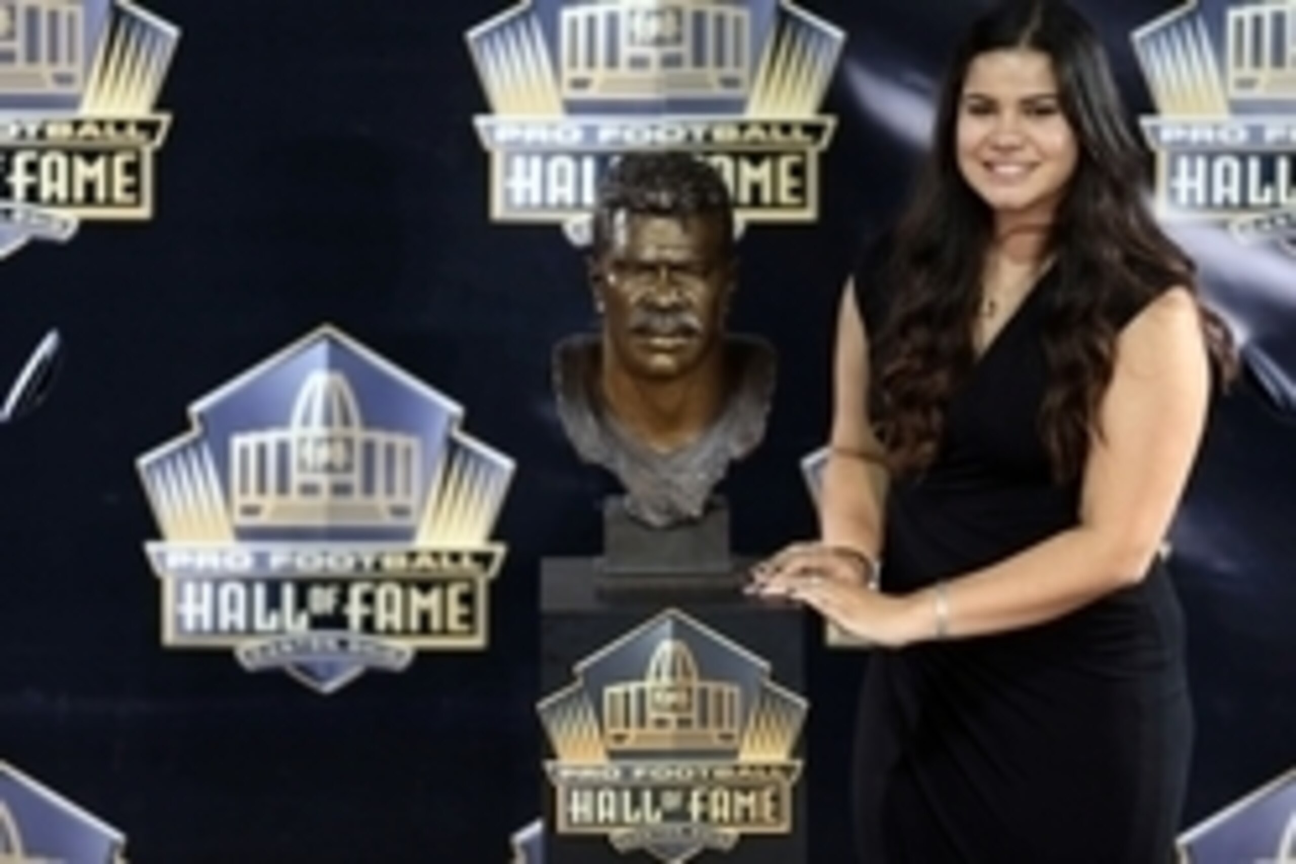 Aug 8, 2015, Canton, OH, USA; Sydney Seau poses with the bust of her late father Junior Seau at the 2015 Pro Football Enshrinement Cermony at Tom Benson Hall of Fame Stadium. Mandatory Credit: Andrew Weber-USA TODAY Sports