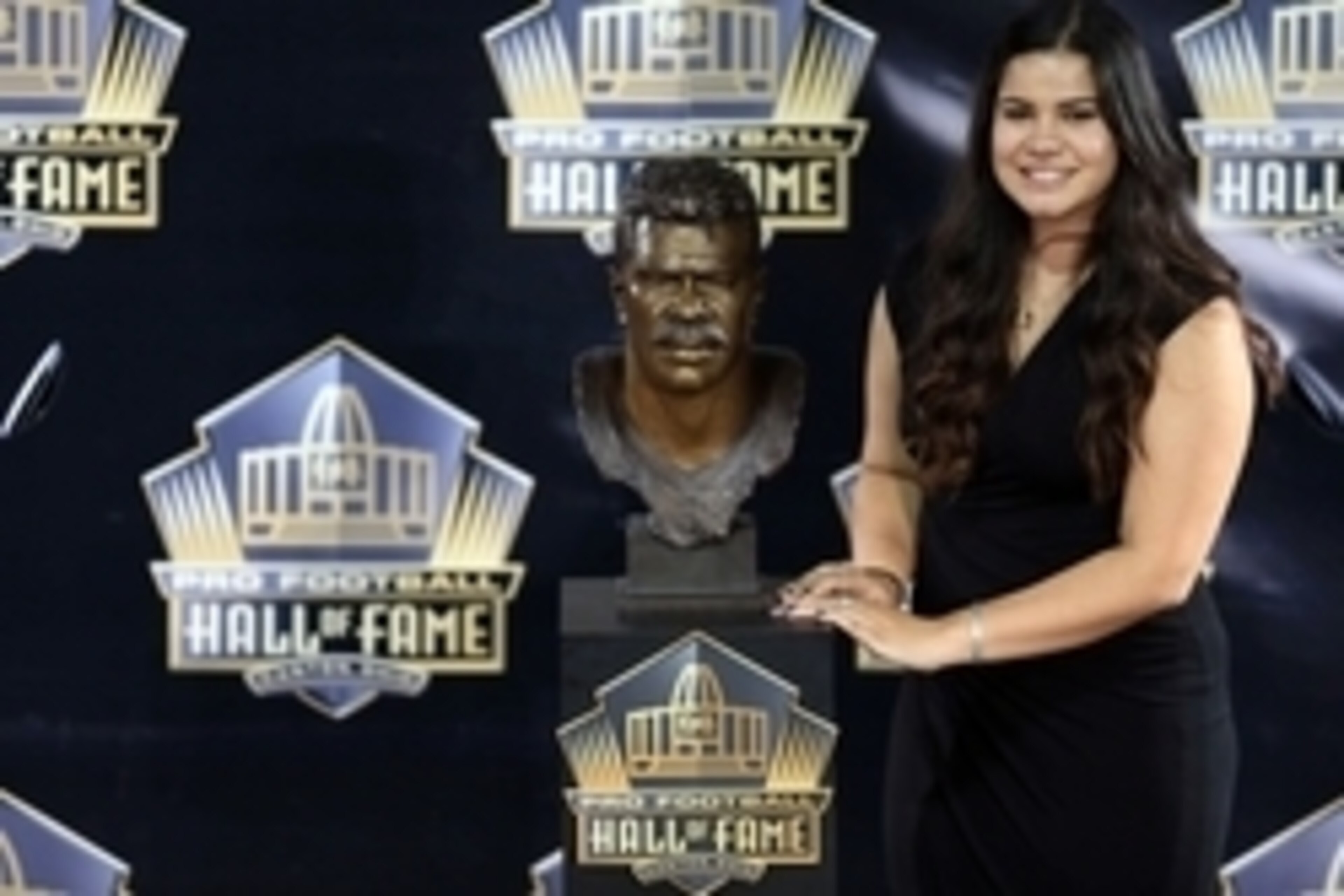Aug 8, 2015, Canton, OH, USA; Sydney Seau poses with the bust of her late father Junior Seau at the 2015 Pro Football Enshrinement Cermony at Tom Benson Hall of Fame Stadium. Mandatory Credit: Andrew Weber-USA TODAY Sports