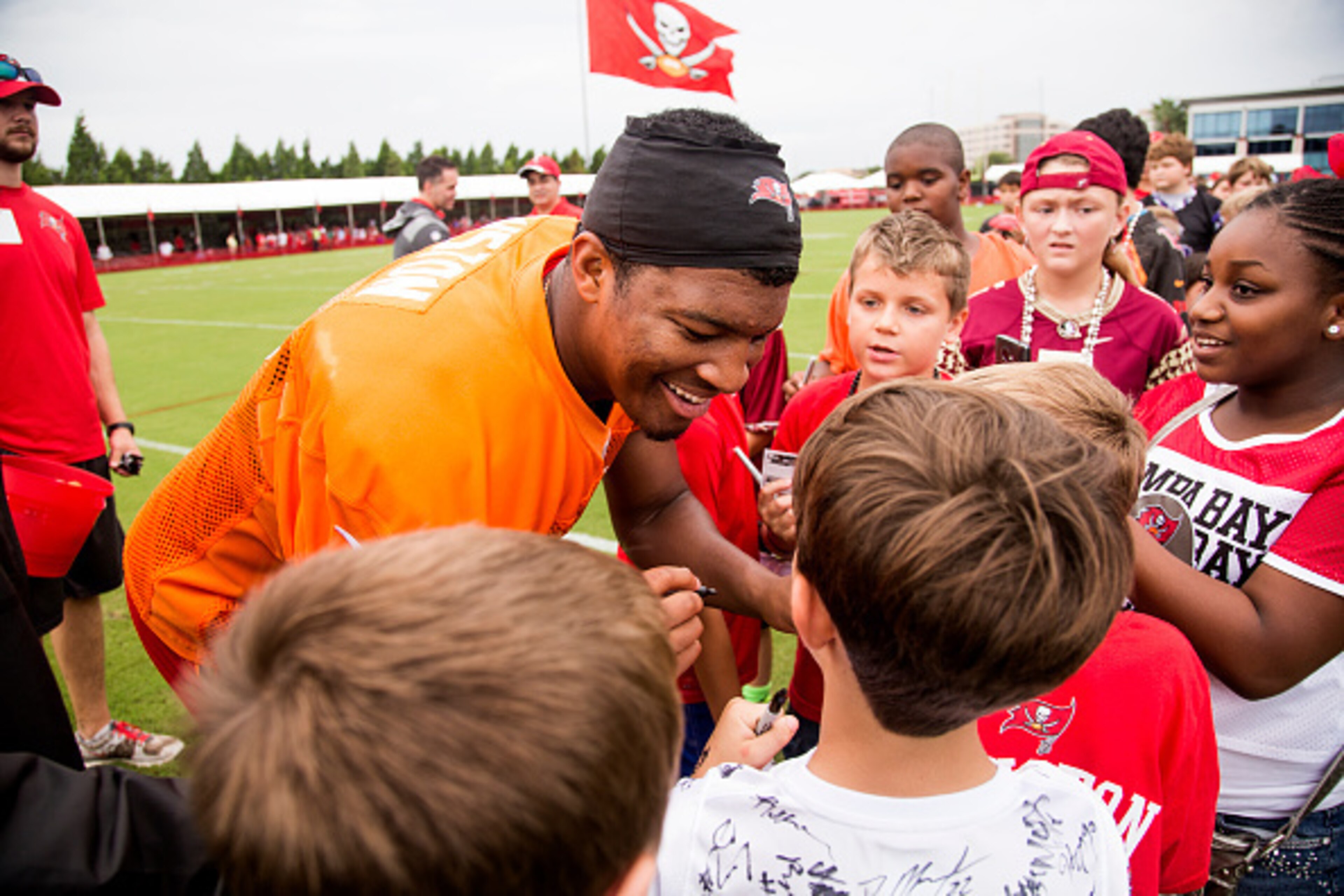 TAMPA, FL - AUGUST 2: Quarterback Jameis Winston #3 of the Tampa Bay Buccaneers signs autographs for fans after training camp at One Buc Place on August 2, 2015 in Tampa, Florida. (Photo by Don Juan Moore/Getty Images)