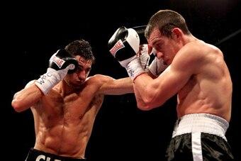 CARDIFF, WALES - FEBRUARY 25:  Nathan Cleverly (L) in action with Tommy Karpency during the WBO Light-Heavyweight Championship bout at the Motorpoint Arena on February 25, 2012 in Cardiff, Wales.  (Photo by Scott Heavey/Getty Images)