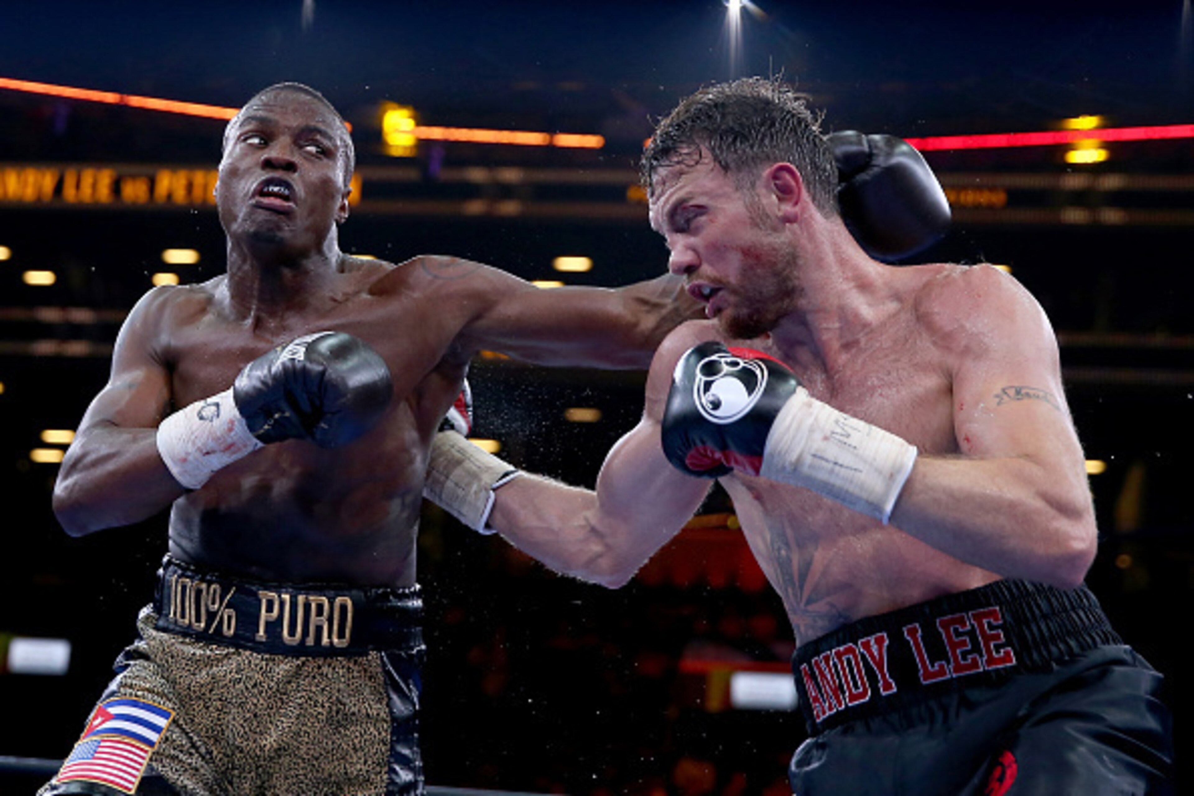 NEW YORK, NY - APRIL 11:  Peter Quillin and Andy Lee exchange punches during the Premier Boxing Champions Middleweight bout at Barclays Center on April 11, 2015 in the Brooklyn borough of New York City.  (Photo by Elsa/Getty Images)