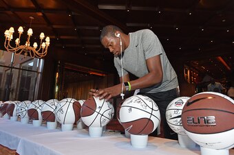 LAS VEGAS, NV - AUGUST 10:  Kevin Durant #35 of the USA National Team signs jerseys and basketballs at the Wynn Las Vegas on August 10, 2015 in Las Vegas, Nevada. NOTE TO USER: User expressly acknowledges and agrees that, by downloading and/or using this 