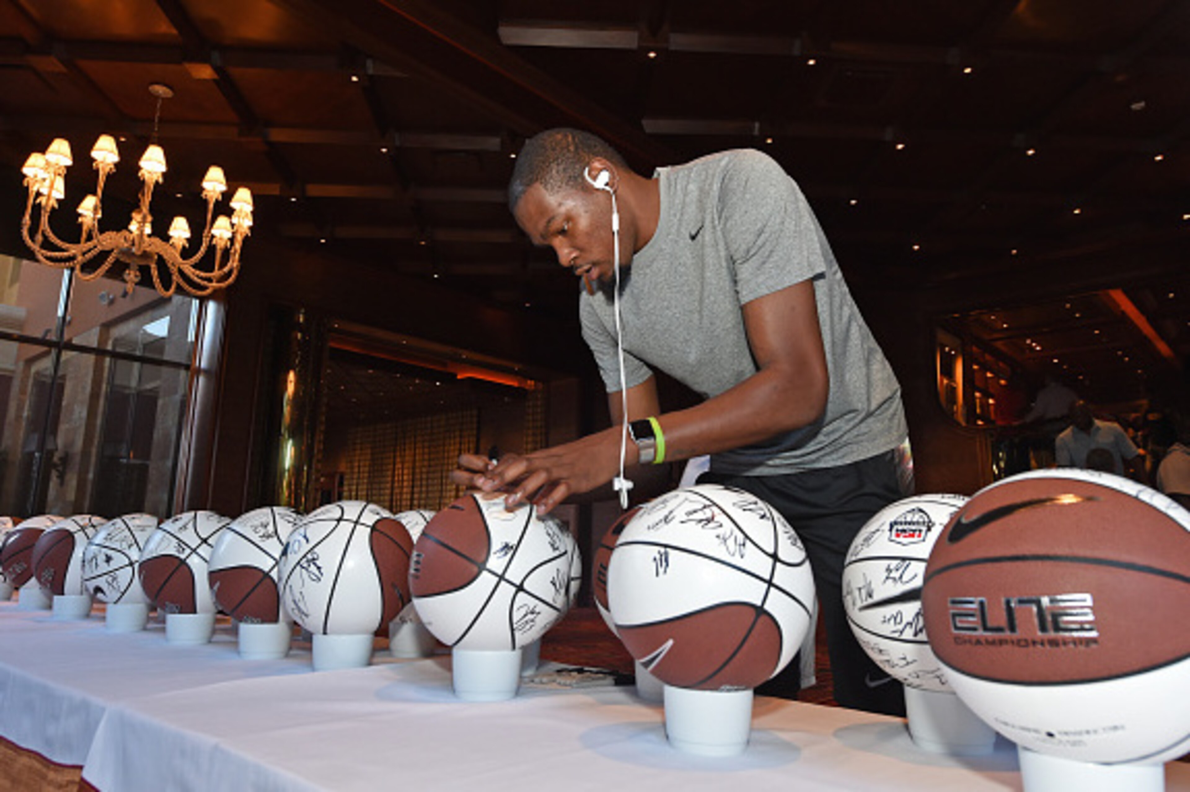 LAS VEGAS, NV - AUGUST 10:  Kevin Durant #35 of the USA National Team signs jerseys and basketballs at the Wynn Las Vegas on August 10, 2015 in Las Vegas, Nevada. NOTE TO USER: User expressly acknowledges and agrees that, by downloading and/or using this 