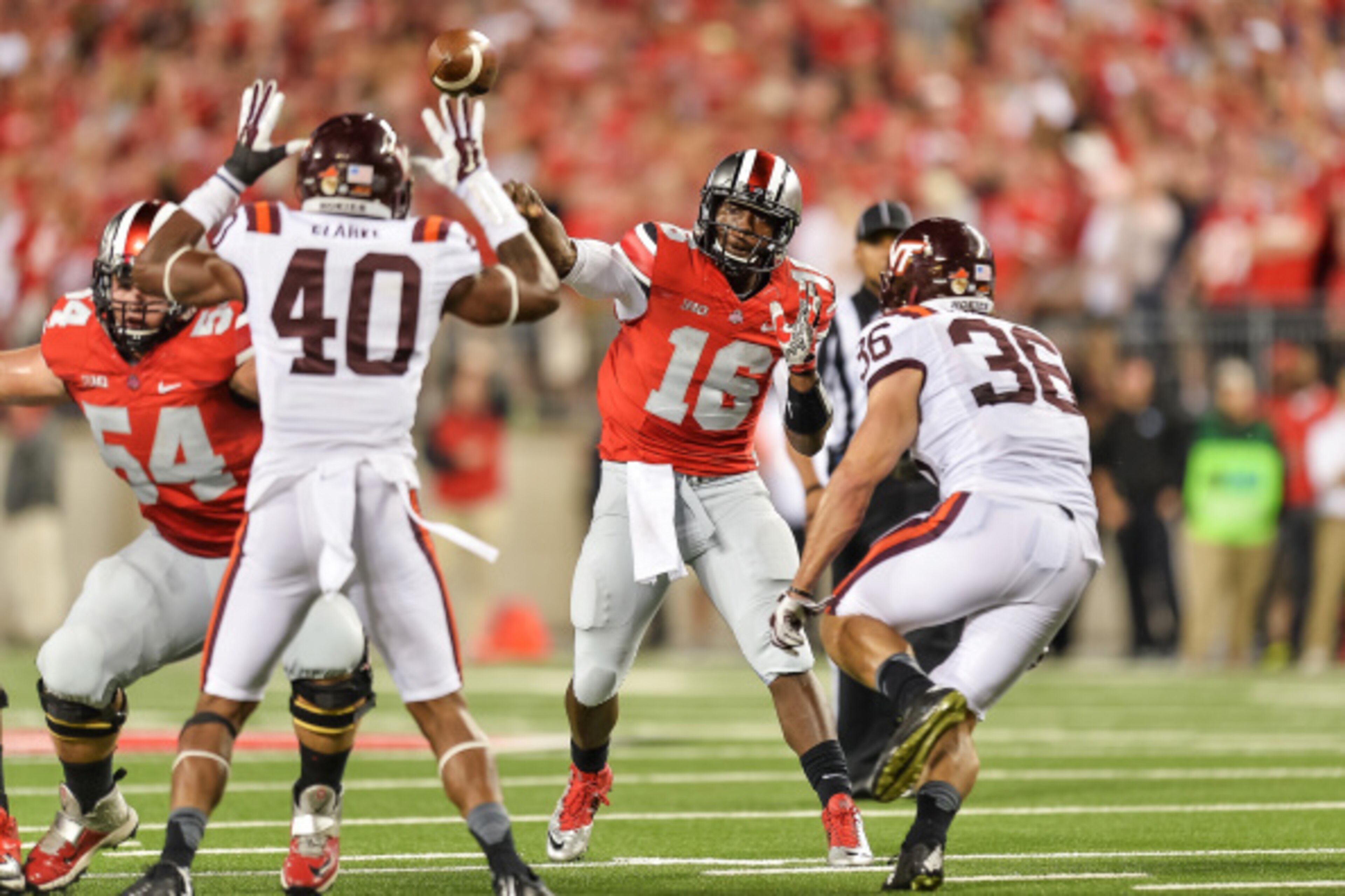 COLUMBUS, OH - SEPTEMBER 6:  Quarterback J.T. Barrett #16 of the Ohio State Buckeyes passes against the Virginia Tech Hokies at Ohio Stadium on September 6, 2014 in Columbus, Ohio.  (Photo by Jamie Sabau/Getty Images)