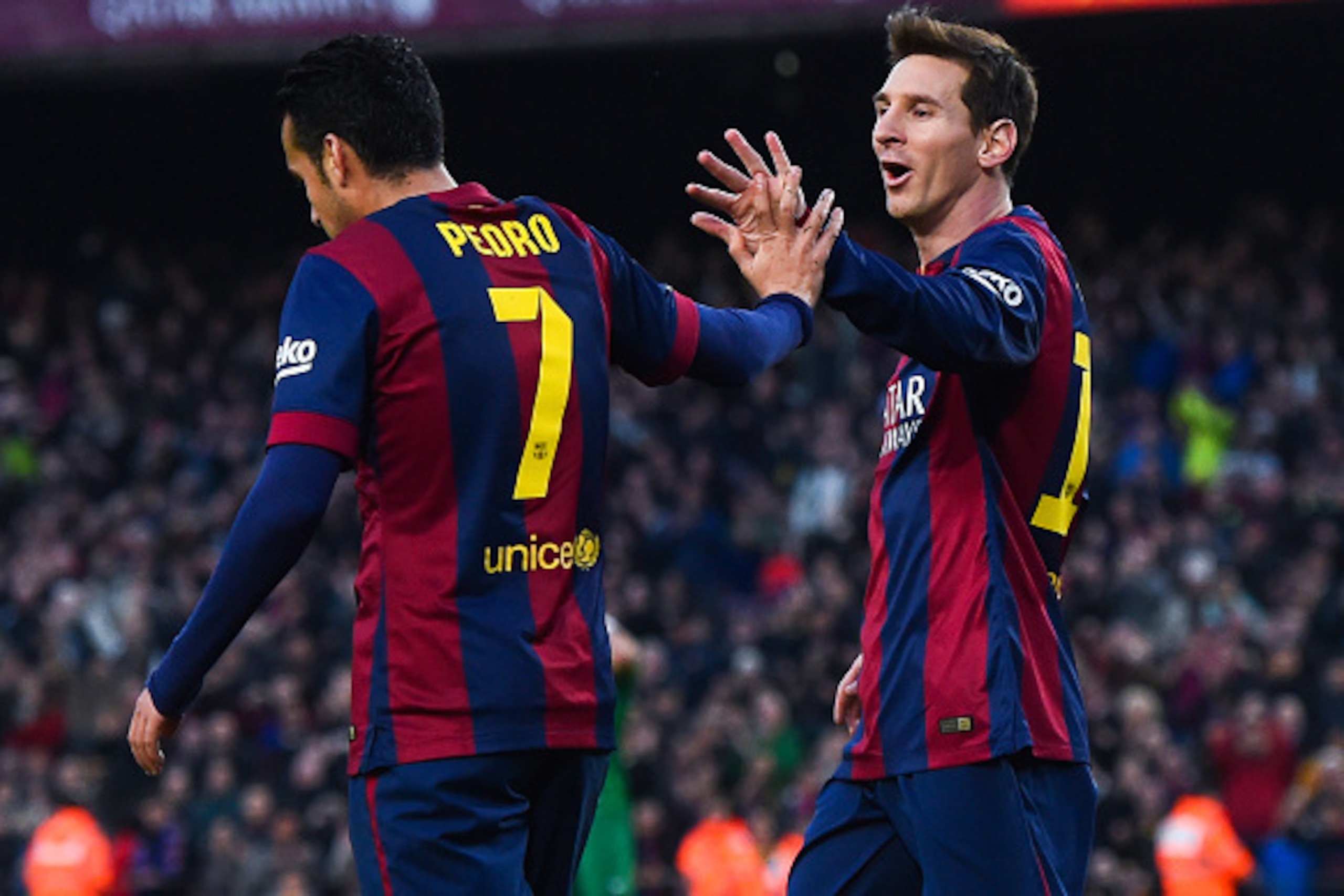 BARCELONA, SPAIN - FEBRUARY 15:  Lionel Messi of FC Barcelona celebrates with his teammate Pedro Rodriguez of FC Barcelona after scoring his team's third goal during the La Liga match between FC Barcelona and Levante UD at Camp Nou on February 15, 2015 in