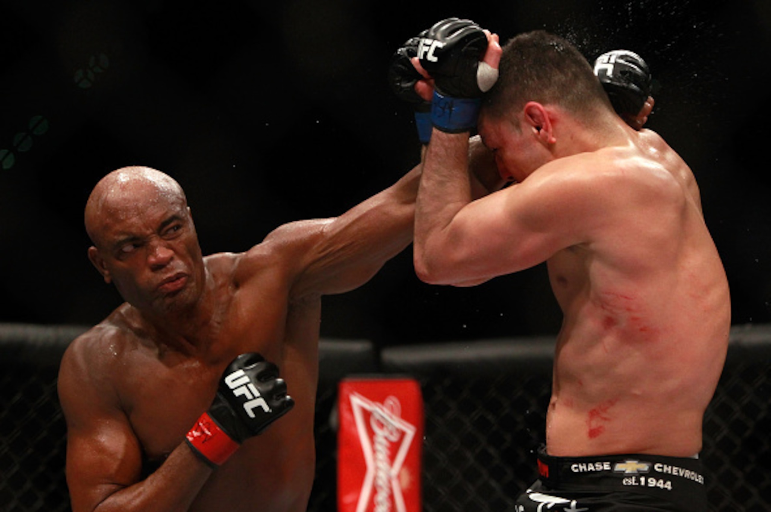 LAS VEGAS, NV - JANUARY 31:  Anderson Silva punches at Nick Diaz in their middleweight bout during UFC 183 at the MGM Grand Garden Arena on January 31, 2015 in Las Vegas, Nevada. Silva won by unanimous decision.  (Photo by Steve Marcus/Getty Images)