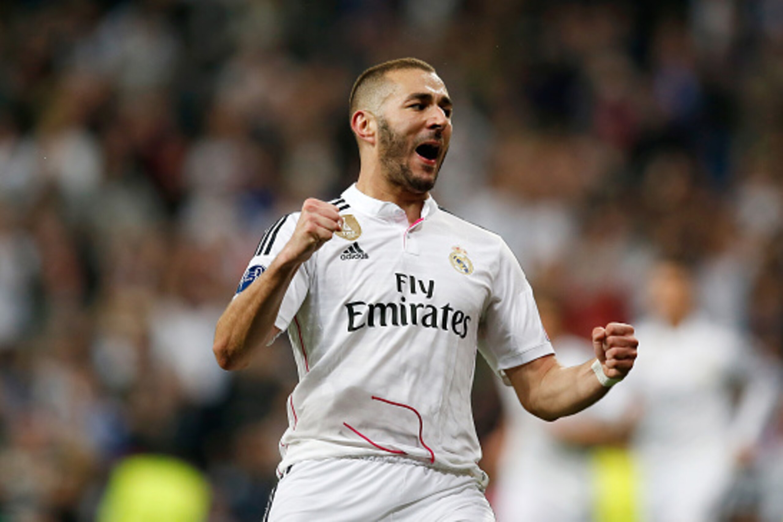 MADRID, SPAIN - MARCH 10:  Karim Benzema of Real Madrid celebrates after scoring his team's third goal during the UEFA Champions League Round of 16 second leg match between Real Madrid CF and FC Schalke 04 at Estadio Santiago Bernabeu on March 10, 2015 in