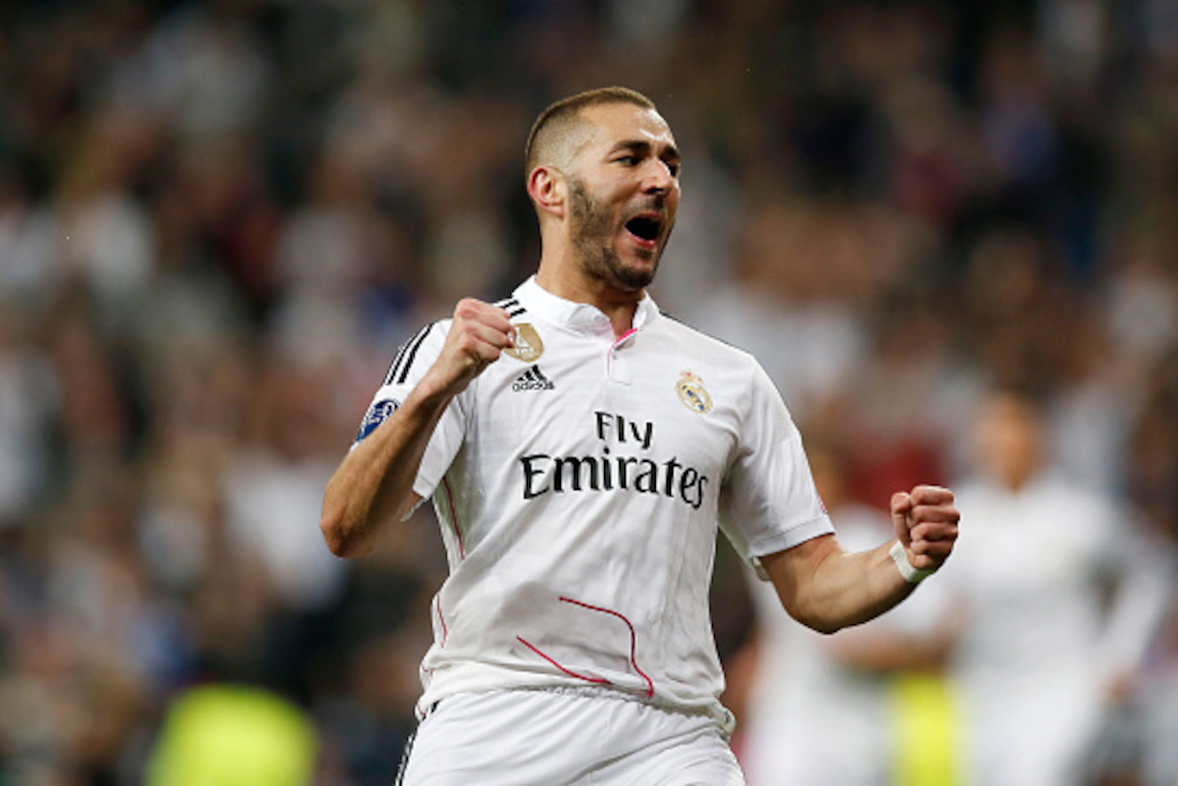 MADRID, SPAIN - MARCH 10:  Karim Benzema of Real Madrid celebrates after scoring his team's third goal during the UEFA Champions League Round of 16 second leg match between Real Madrid CF and FC Schalke 04 at Estadio Santiago Bernabeu on March 10, 2015 in