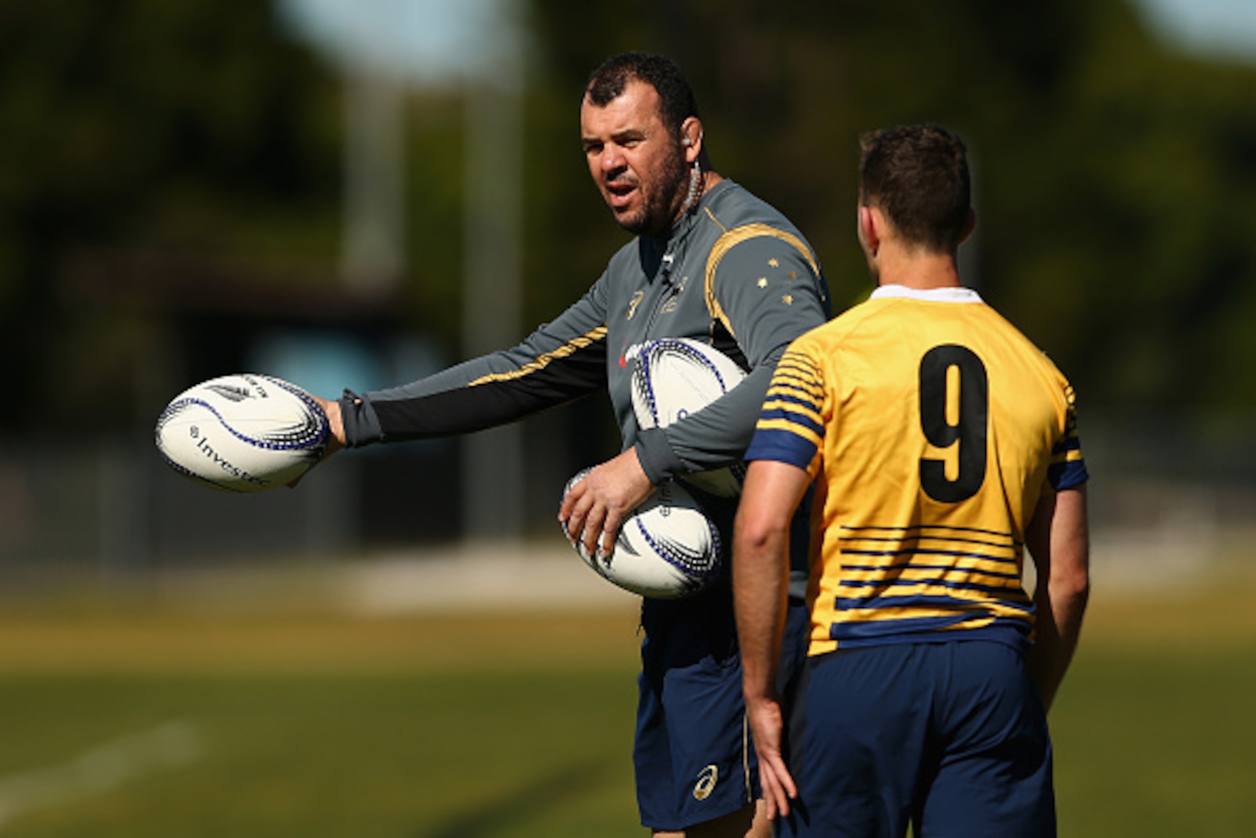 SYDNEY, AUSTRALIA - AUGUST 11: Wallabies coach Michael Cheika talks to Nic White of the Wallabies during an Australian Wallabies training session at Tramway Oval on August 11, 2015 in Sydney, Australia.  (Photo by Cameron Spencer/Getty Images)