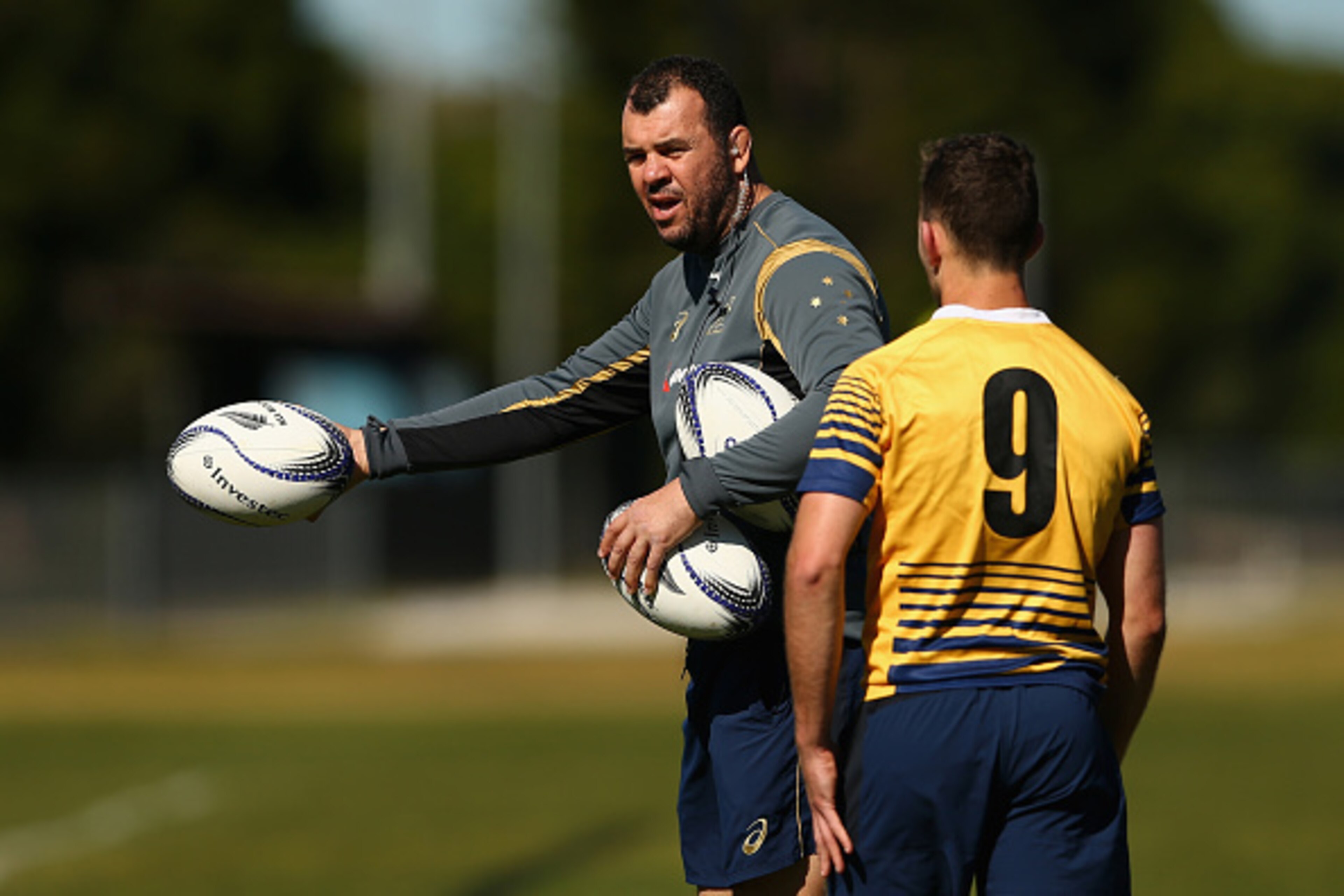 SYDNEY, AUSTRALIA - AUGUST 11: Wallabies coach Michael Cheika talks to Nic White of the Wallabies during an Australian Wallabies training session at Tramway Oval on August 11, 2015 in Sydney, Australia.  (Photo by Cameron Spencer/Getty Images)