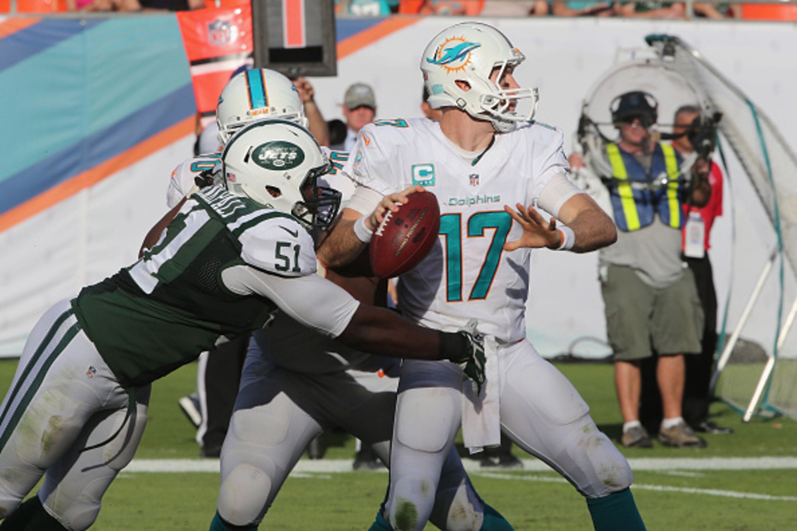 MIAMI GARDENS, FL - DECEMBER 28: Linebacker Ikemefuna Enemkpali #51 of the New York Jets pressures Quarterback Ryan Tannehill #17 of the Miami Dolphins at Sun Life Stadium on December 28, 2014 in Miami Gardens, Florida. (Photo by Al Pereira/New York Jets/