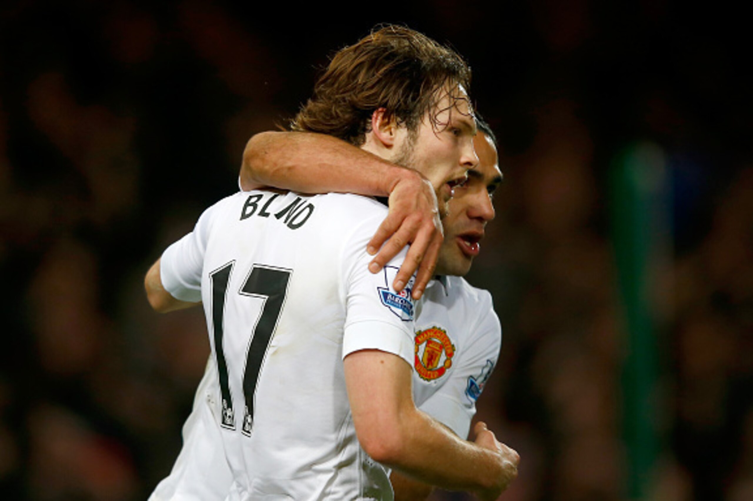 LONDON, ENGLAND - FEBRUARY 08:  Daley Blind of Manchester United celebrates scoring their first goal with Marouane Fellaini of Manchester United during the Barclays Premier League match between West Ham United and Manchester United at Boleyn Ground on Feb