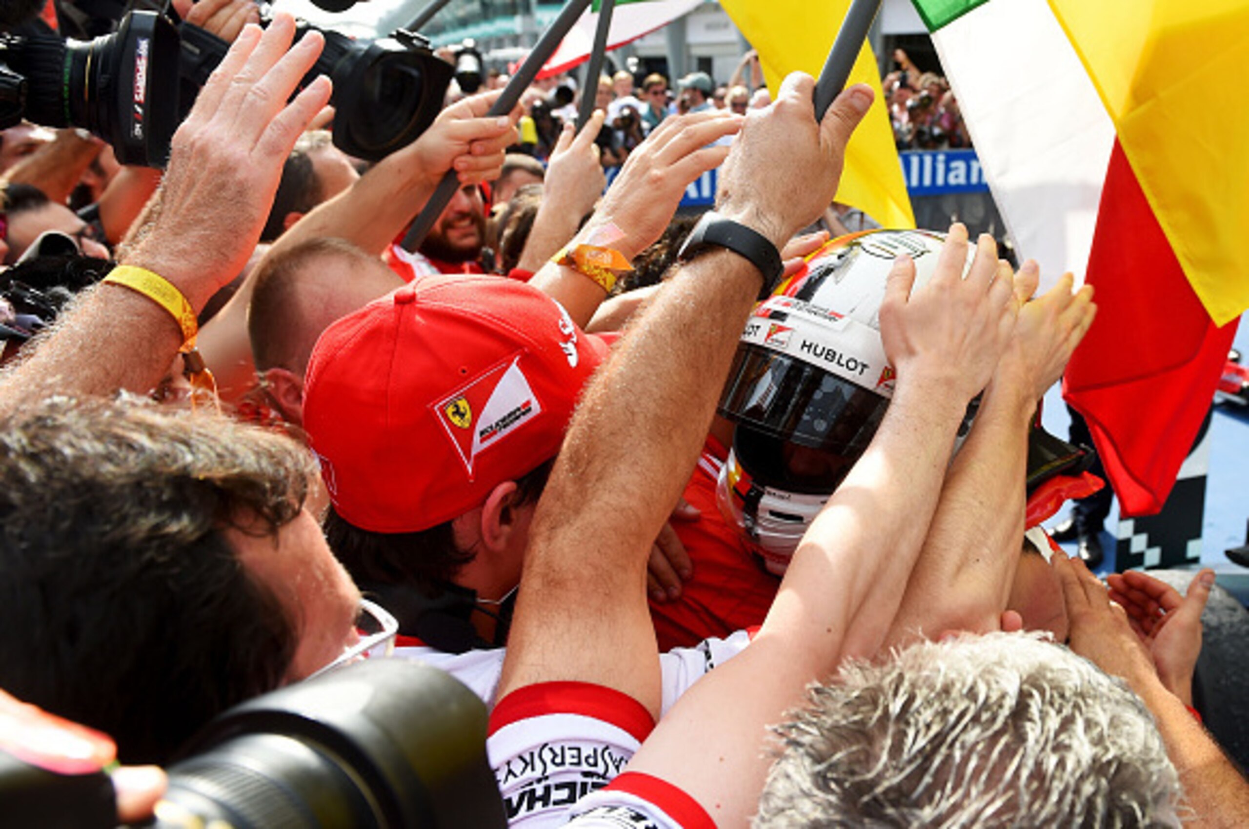 KUALA LUMPUR, MALAYSIA - MARCH 29:  Sebastian Vettel of Germany and Ferrari celebrates in Parc Ferme after winning the Malaysia Formula One Grand Prix at Sepang Circuit on March 29, 2015 in Kuala Lumpur, Malaysia.  (Photo by Lars Baron/Getty Images)