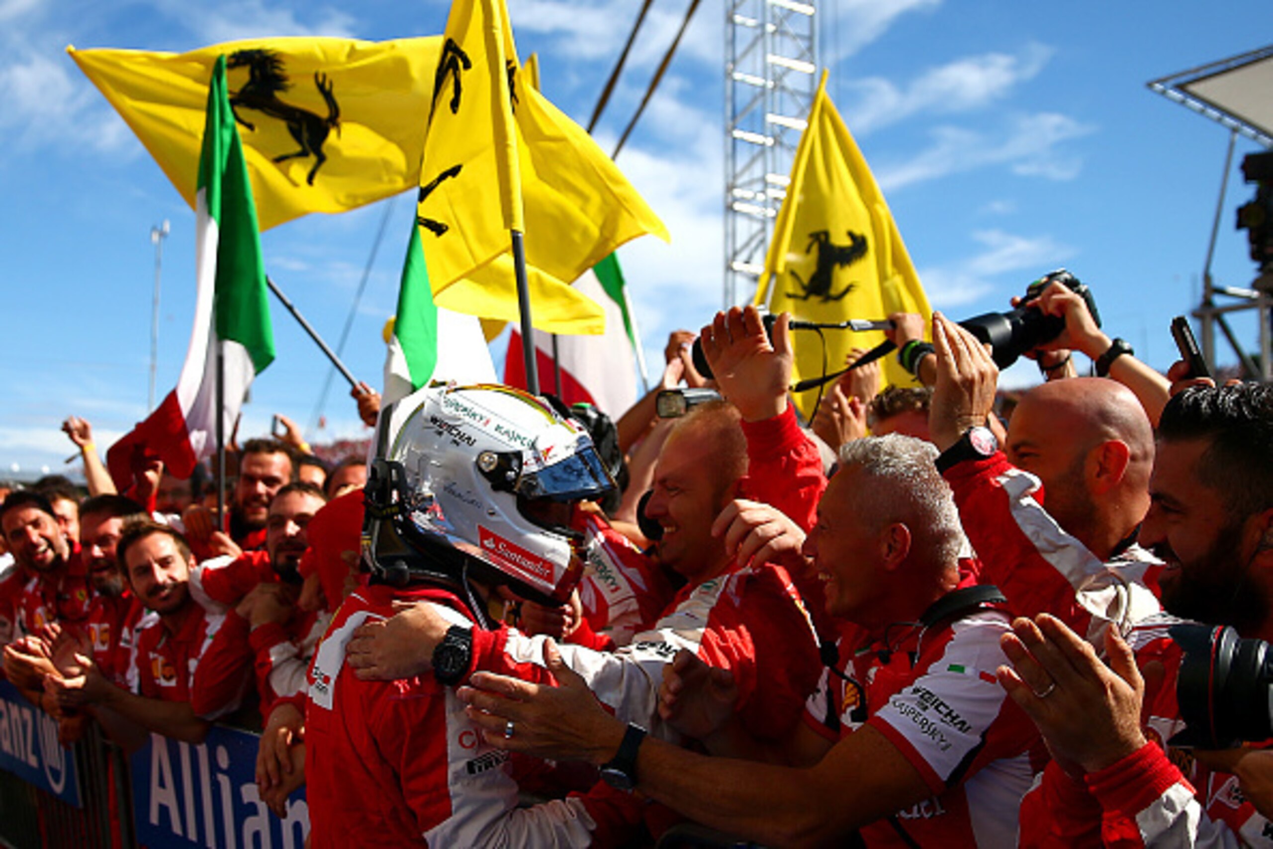BUDAPEST, HUNGARY - JULY 26:  Sebastian Vettel of Germany and Ferrari celebrates with the team in Parc Ferme after winning the Formula One Grand Prix of Hungary at Hungaroring on July 26, 2015 in Budapest, Hungary.  (Photo by Dan Istitene/Getty Images)