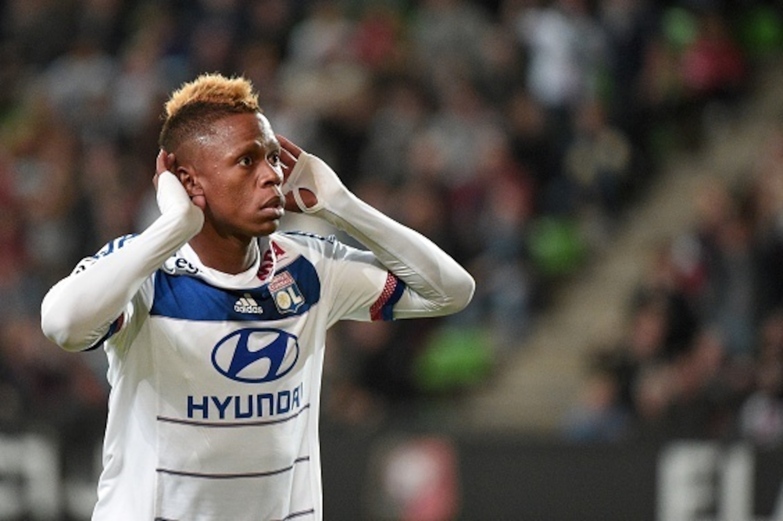 Lyon's Cameroonian forward Clinton Njie gestures after scoring a goal  during the French L1 football match Rennes against Lyon on May 23, 2015 at the route de Lorient stadium in Rennes, western France. AFP PHOTO / DAMIEN MEYER        (Photo credit should 