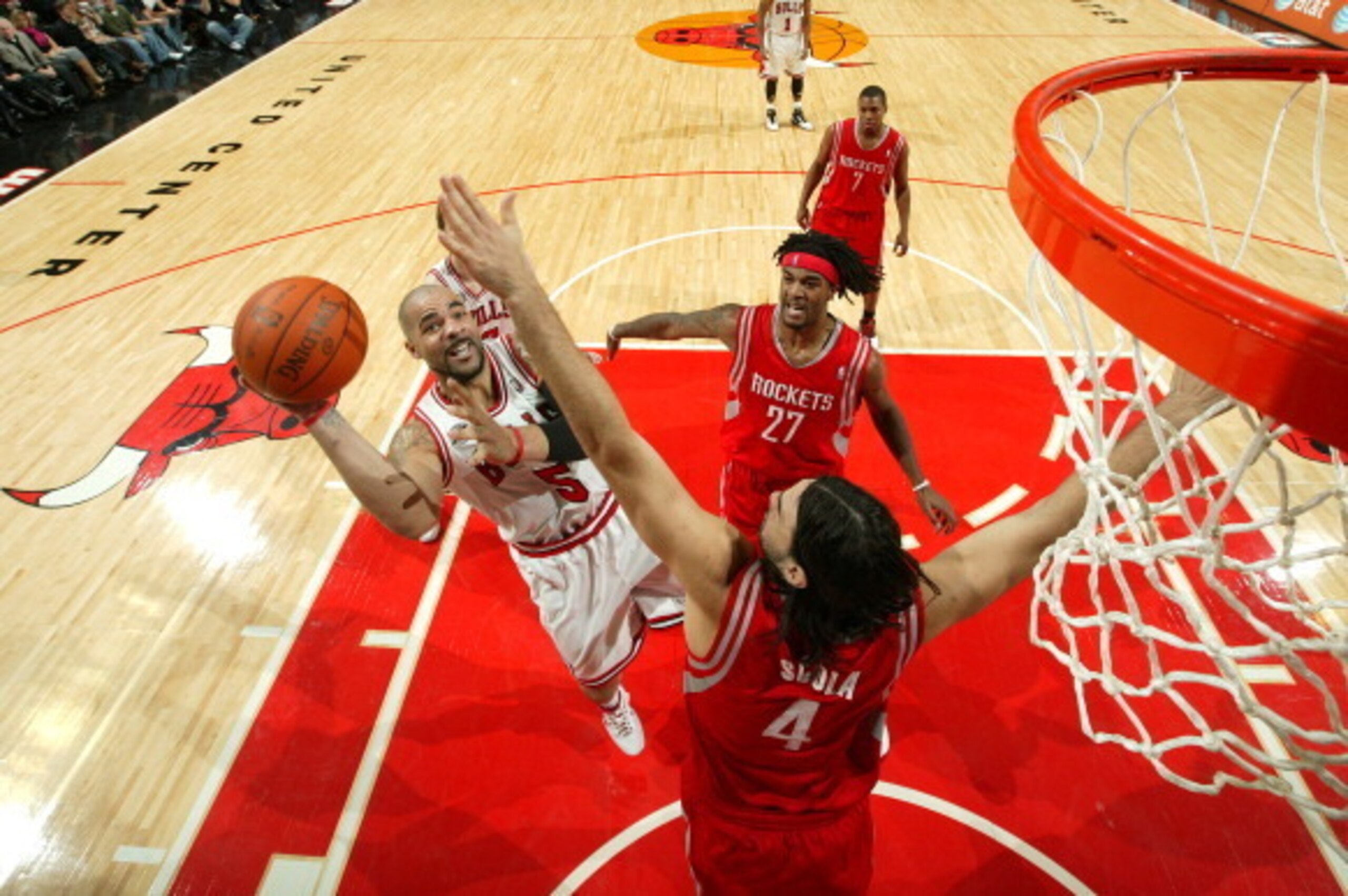 CHICAGO - DECEMBER 04: Carlos Boozer #5 of the Chicago Bulls Luis Scola #4 and Jordan Hill #27 of the Houston Rockets during the NBA game on December 4, 2010 at the United Center in Chicago, Illinois. NOTE TO USER: User expressly acknowledges and agrees t