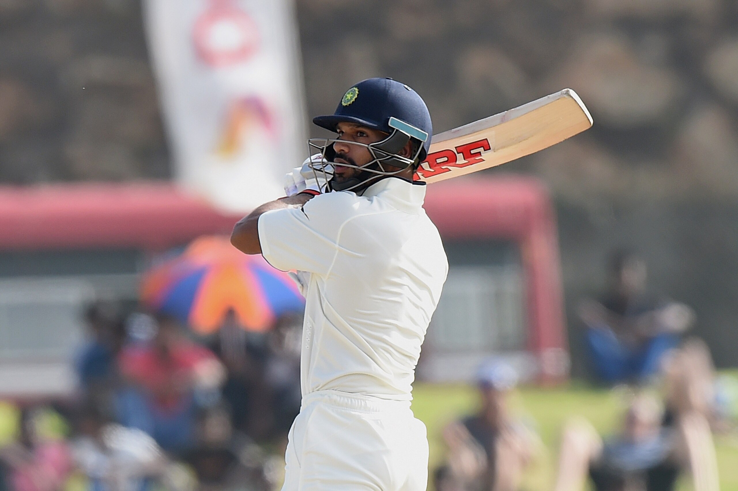 Indian cricketer Shikhar Dhawan plays a shot during the first day of the opening Test match between Sri Lanka and India at the Galle International Cricket Stadium in Galle on August 12, 2015. AFP PHOTO/ Ishara S. KODIKARA        (Photo credit should read