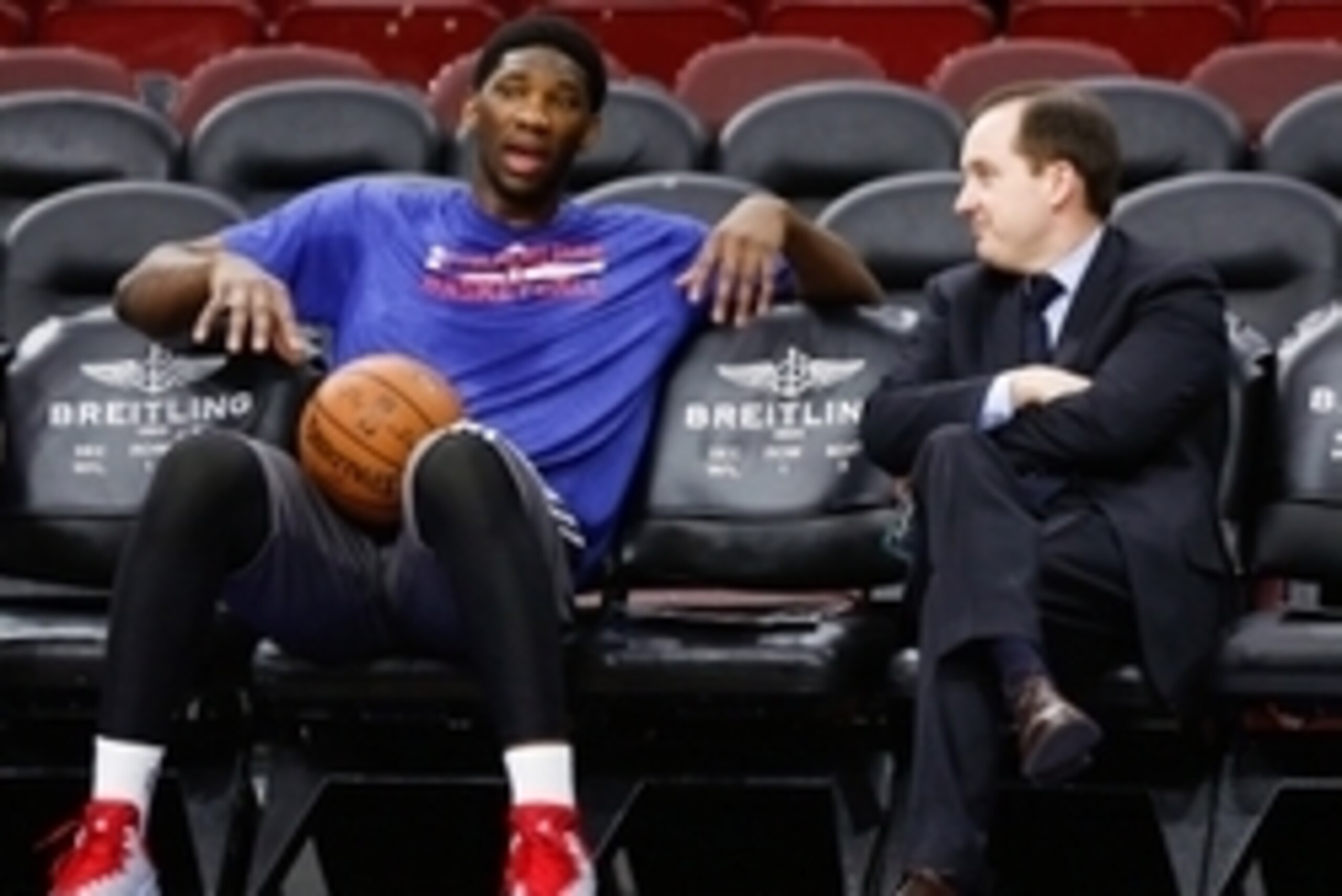Dec 15, 2014; Philadelphia, PA, USA; Injured Philadelphia 76ers center Joel Embiid (left) talks with general manager and president Sam Hinkie (right) before a game against the Boston Celtics at Wells Fargo Center. Mandatory Credit: Bill Streicher-USA TODA
