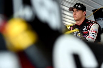LONG POND, PA - JULY 31:  Cameron Hayley, driver of the #13 Cabinets by Hayley / Carolina Nut Co. Toyota, stands in the garage area during practice for the NASCAR Camping World Truck Series Pocono Mountains 150 at Pocono Raceway on July 31, 2015 in Long P