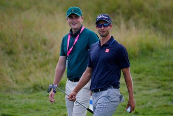 SHEBOYGAN, WI - AUGUST 11:  Adam Scott of Australia and coach and brother in law Brad Malone walk on a fairway during a practice round prior to the 2015 PGA Championship at Whistling Straits on August 11, 2015 in Sheboygan, Wisconsin.  (Photo by Kevin C. 