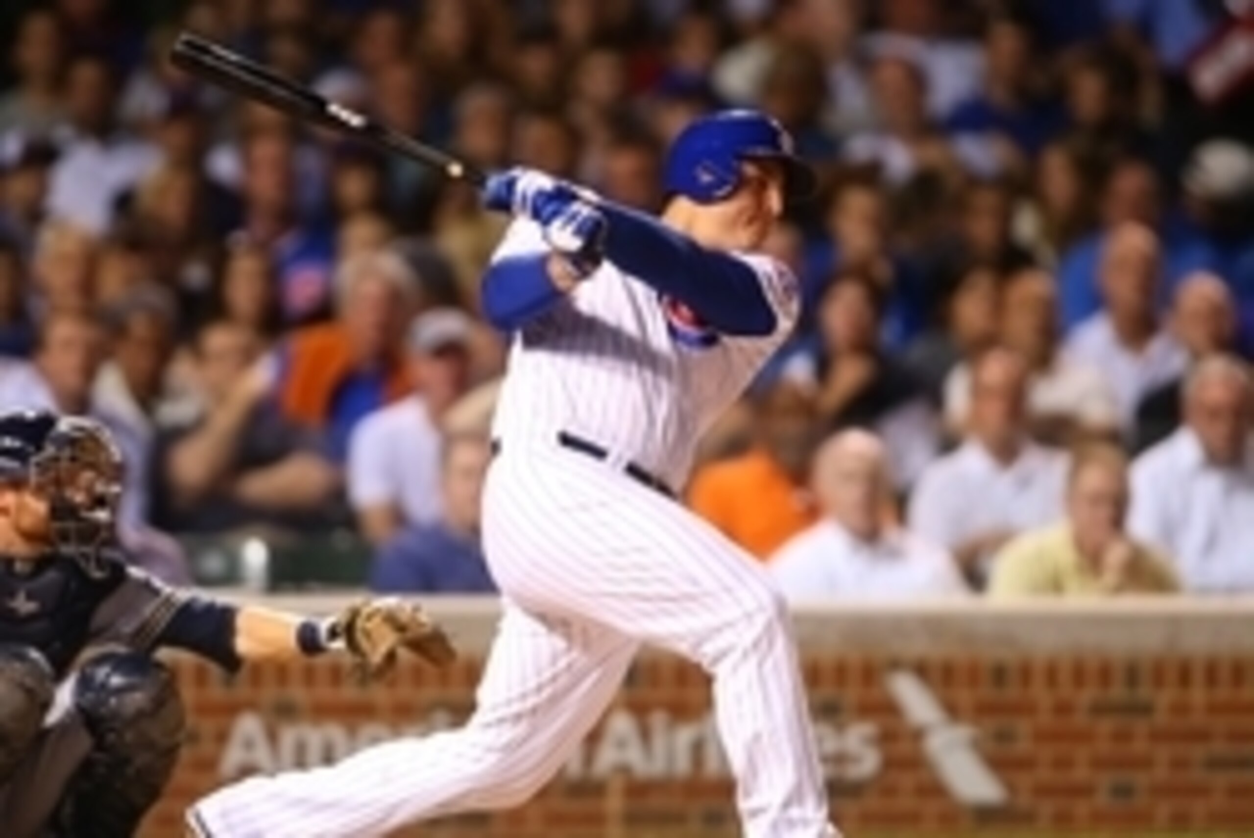 Aug 11, 2015; Chicago, IL, USA; Chicago Cubs first baseman Anthony Rizzo (44) hits a single during the sixth inning against the Milwaukee Brewers at Wrigley Field. Mandatory Credit: Caylor Arnold-USA TODAY Sports