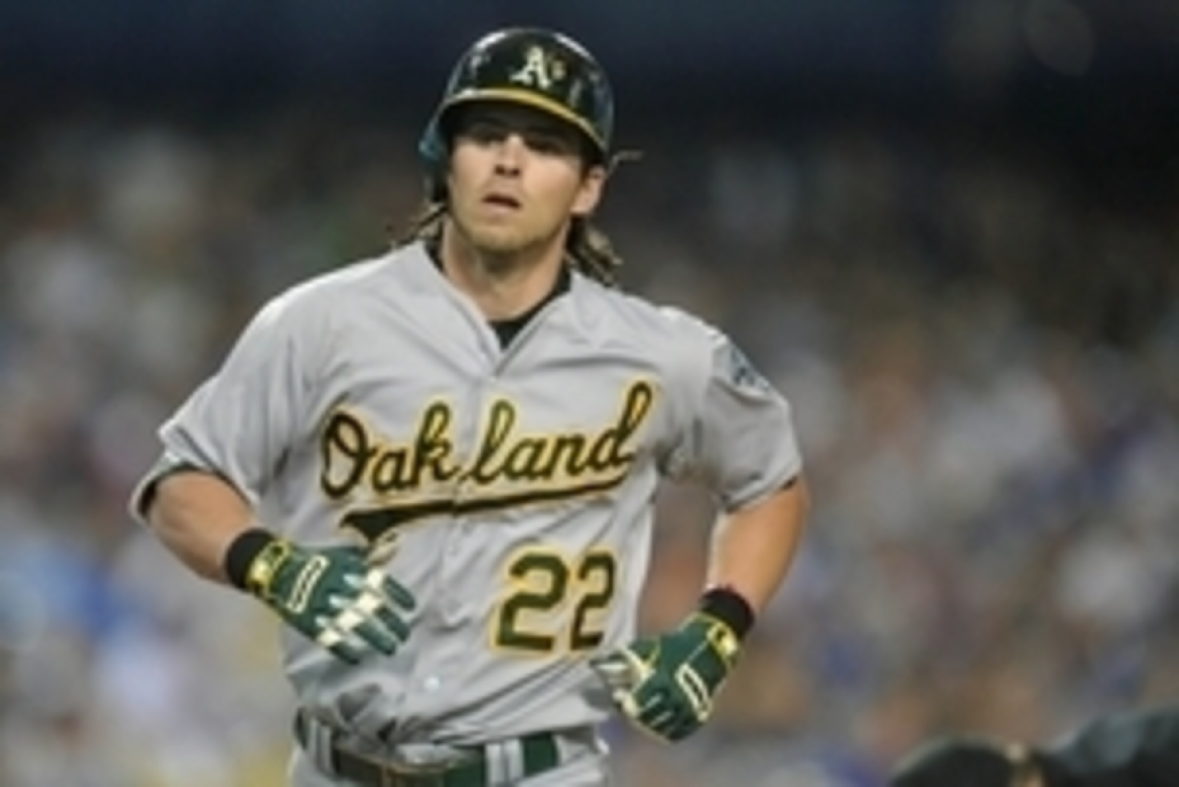 July 28, 2015; Los Angeles, CA, USA; Oakland Athletics right fielder Josh Reddick (22) approaches home plate after hitting a solo home run in the seventh inning against the Los Angeles Dodgers at Dodger Stadium. Mandatory Credit: Gary A. Vasquez-USA TODAY