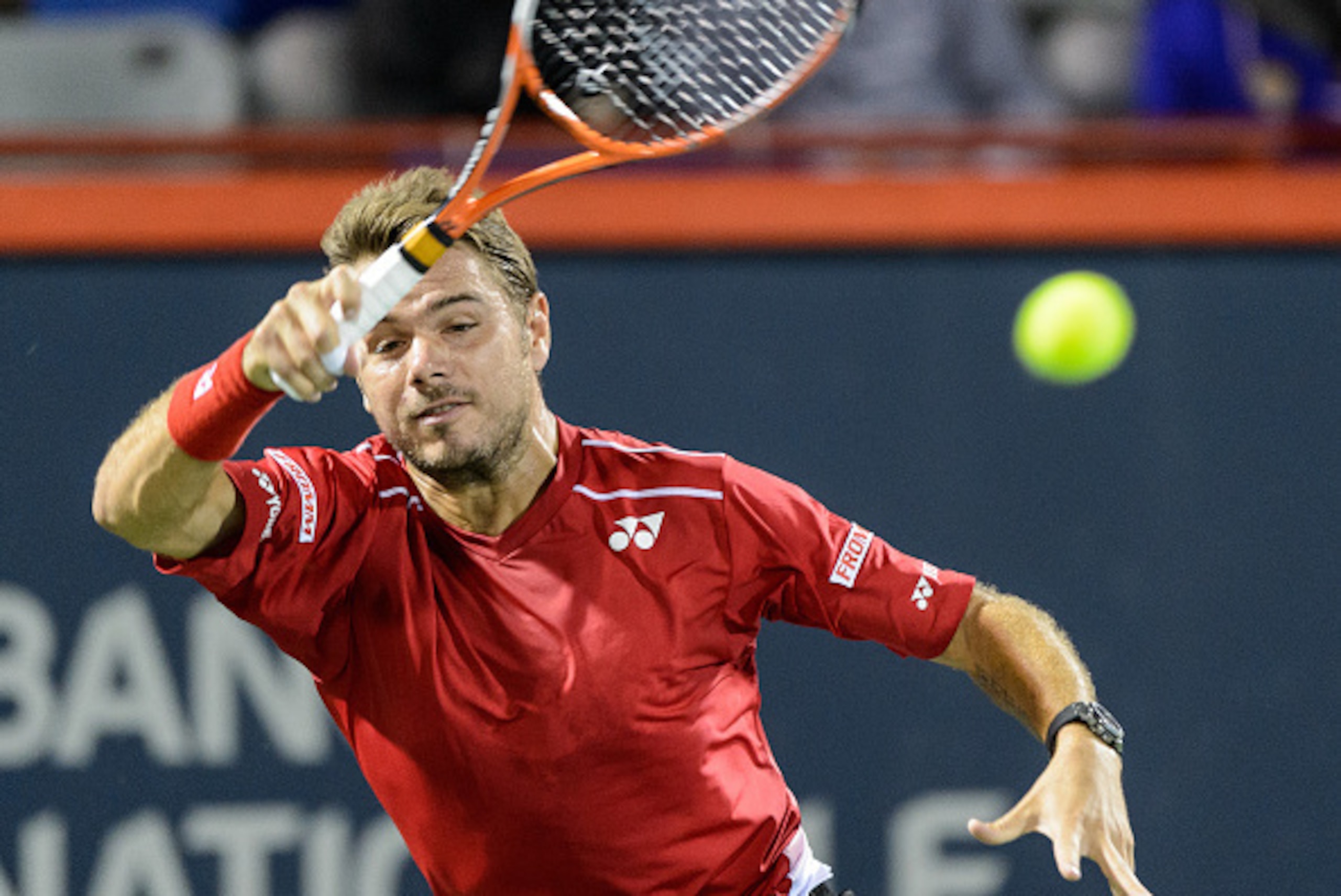 MONTREAL, ON - AUGUST 12:  Stan Wawrinka of Switzerland hits a return against Nick Kyrgios of Australia during day three of the Rogers Cup at Uniprix Stadium on August 12, 2015 in Montreal, Quebec, Canada.  (Photo by Minas Panagiotakis/Getty Images)