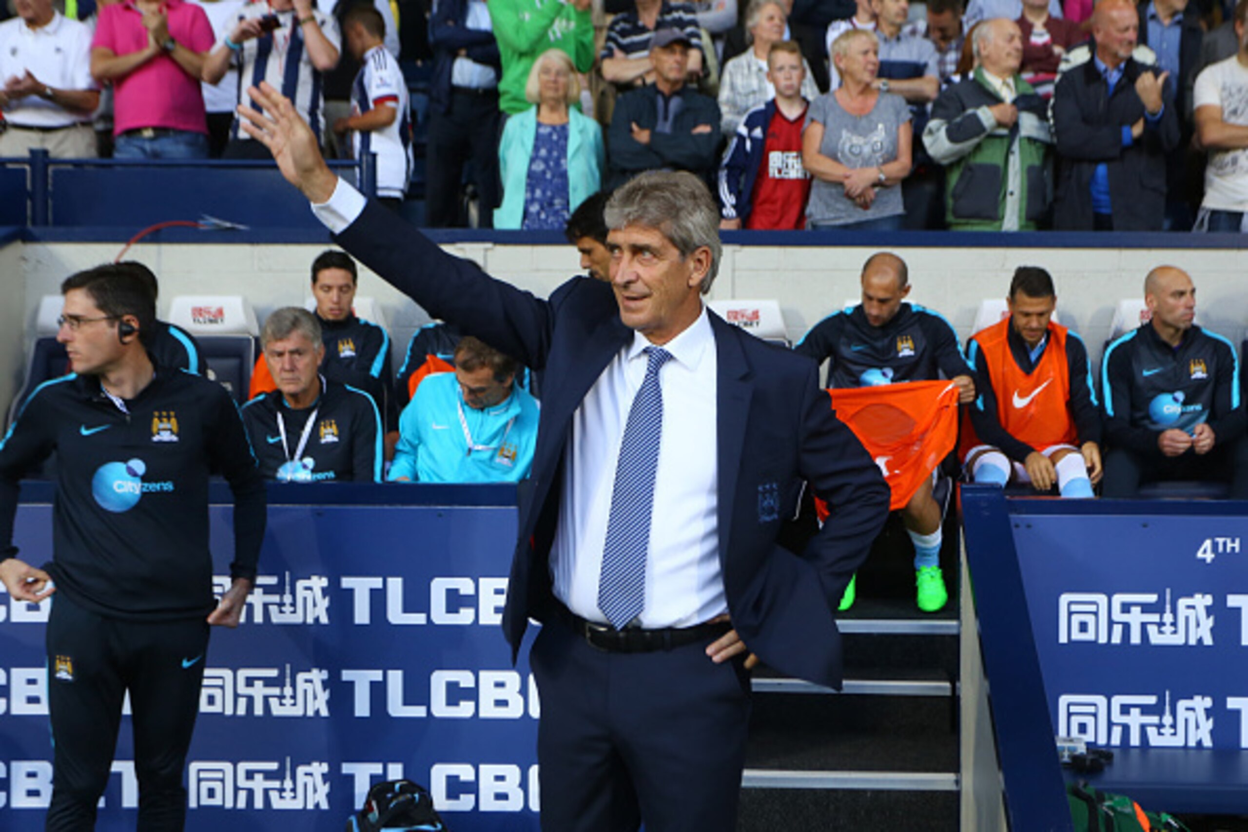 WEST BROMWICH, ENGLAND - AUGUST 10: Manuel Pellegrini manager of Manchester City waves during the Barclays Premier League match between West Bromwich Albion and Manchester City at The Hawthorns  on August 10, 2015 in West Bromwich, England.  (Photo by Cat