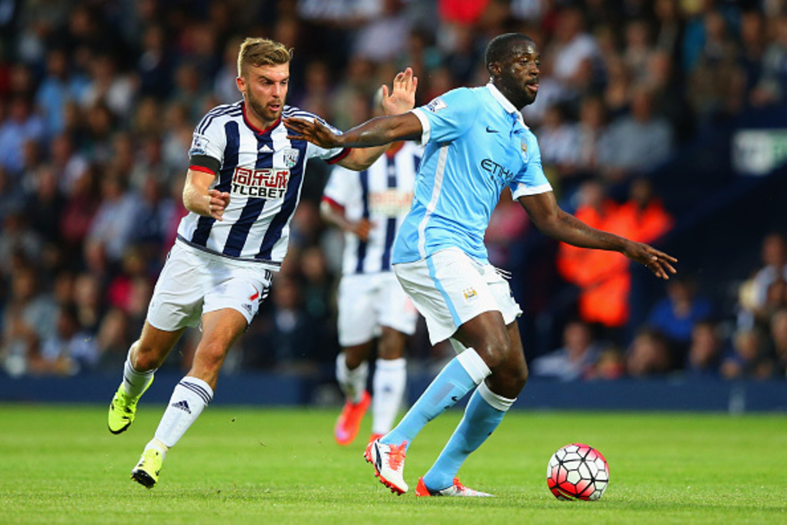 WEST BROMWICH, ENGLAND - AUGUST 10:  Yaya Toure of Manchester City holds off James Morrison of West Bromwich Albion during the Barclays Premier League match between West Bromwich Albion and Manchester City at The Hawthorns on August 10, 2015 in West Bromw
