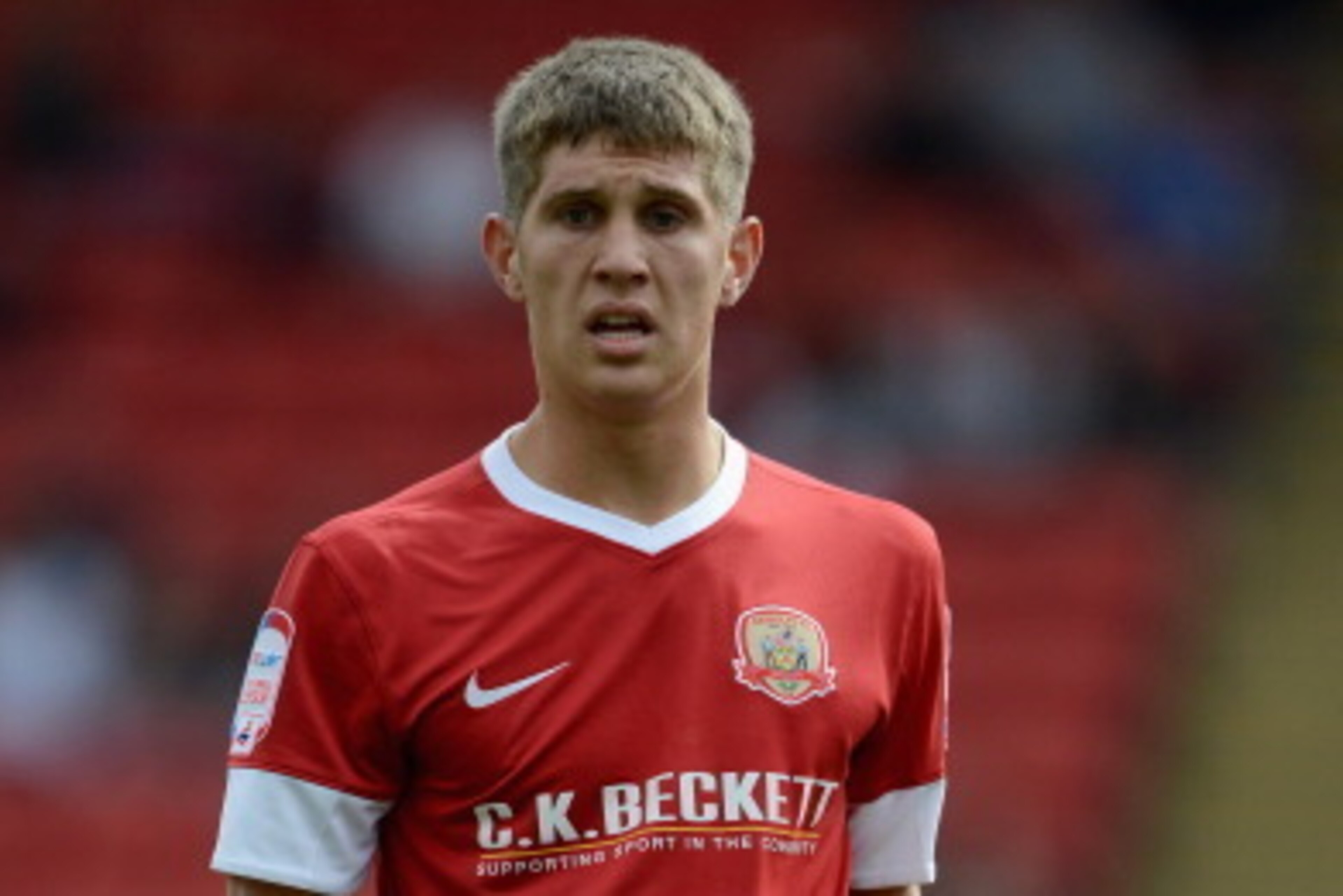 BARNSLEY, ENGLAND - JULY 28:  John Stones of Barnsley in action during the Pre Season Friendly between Barnsley and West Bromwich Albion at Oakwell Stadium on July 28, 2012 in Barnsley, England.  (Photo by Gareth Copley/Getty Images)