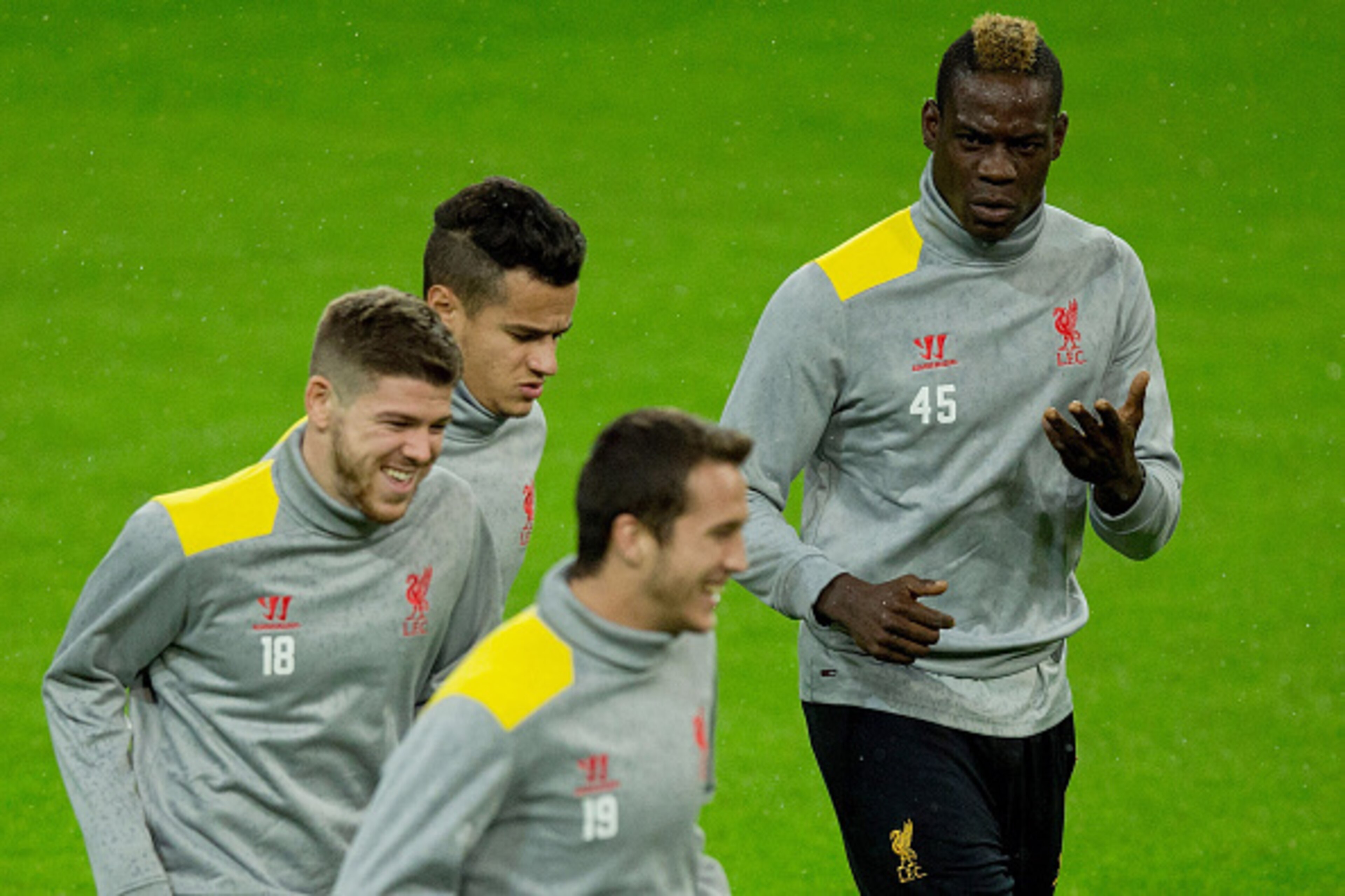 MADRID, SPAIN - NOVEMBER 03:  Mario Balotelli (R) of Liverpool FC exercises with team-mates Javier Manquillo (2ndR), Alberto Moreno (L) and Philippe Coutinho (2nd L) during the training session ahead of the UEFA Champions League Group B match between Real